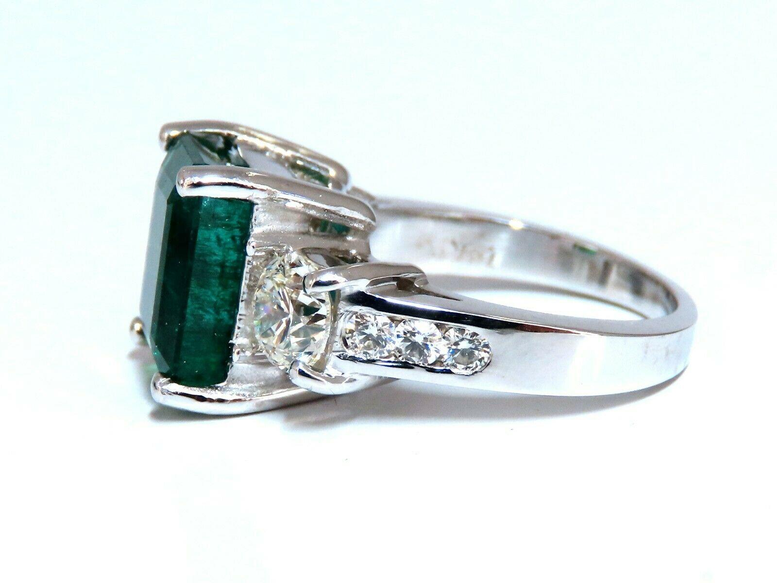 Three Stone Green.

6.06ct. Natural Emerald Ring

GIA Certified: #2357603193(To Accompany)

11.24 X 9.71 x 6.44mm

Full cut Emerald Cut brilliant 

Clean Clarity & Transparent (F2)

Vivid Green / Zambia Best



1.44ct. (2) Side Round