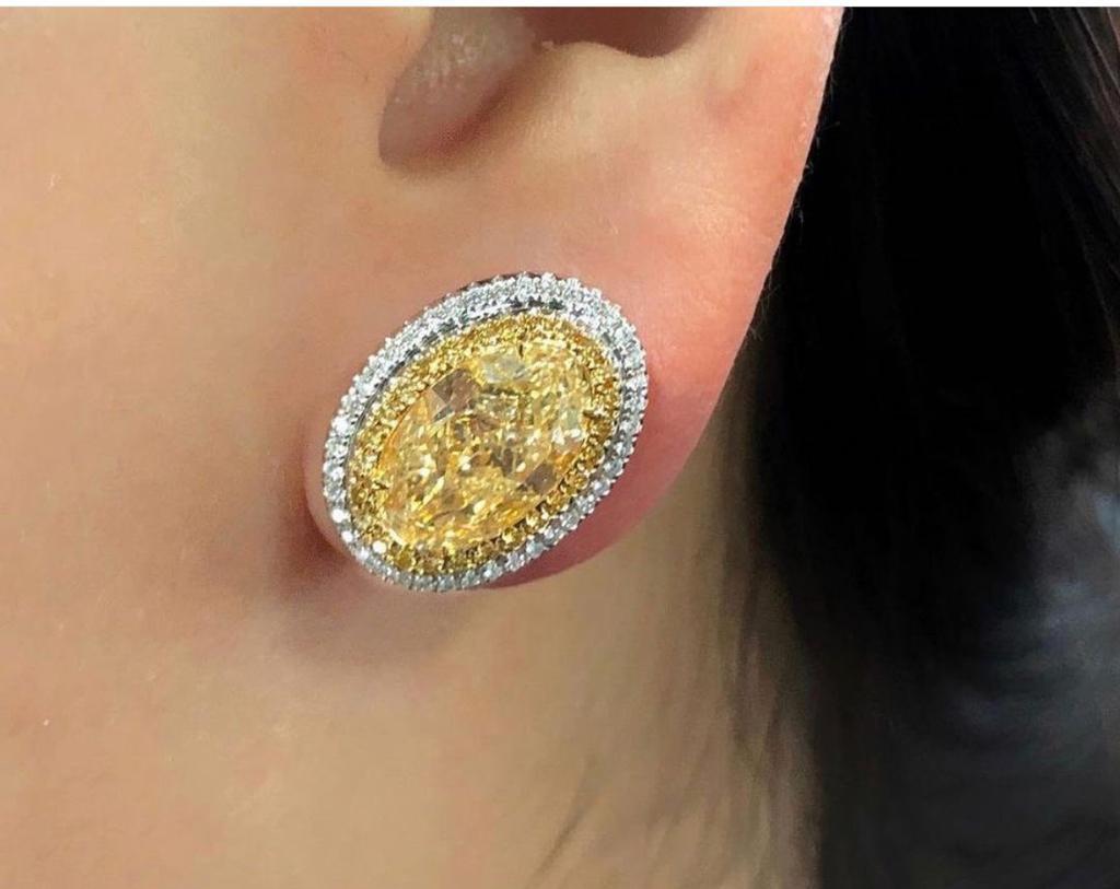 Modern GIA Certified 6.06ct Oval Y-X 'Yellow' Diamond Earrings For Sale