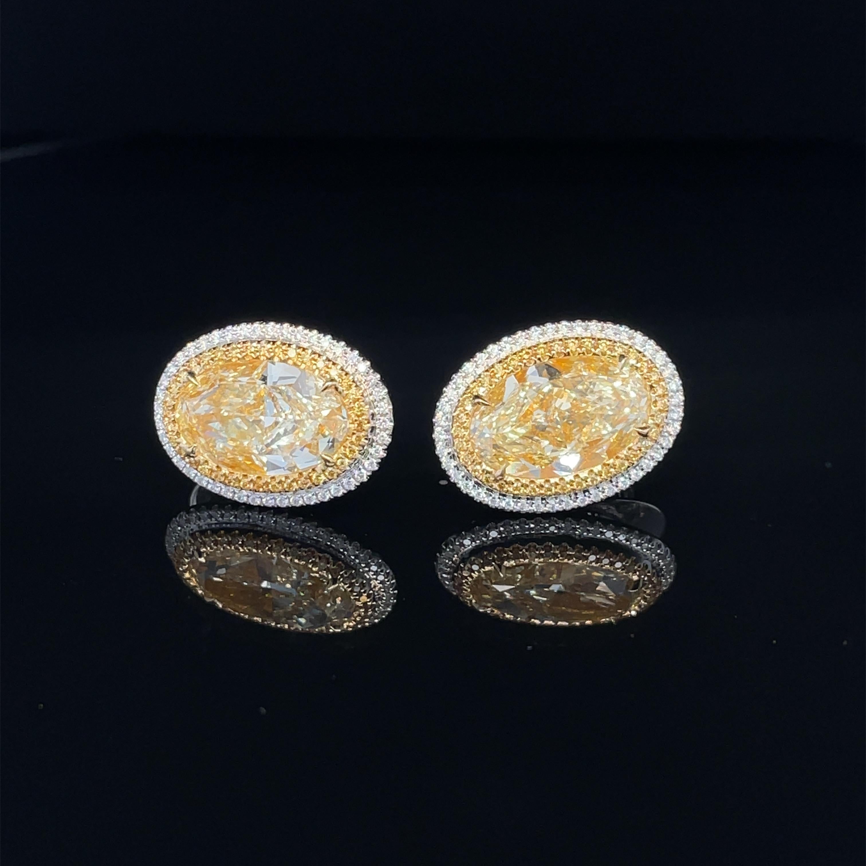 Oval Cut GIA Certified 6.06ct Oval Y-X 'Yellow' Diamond Earrings For Sale