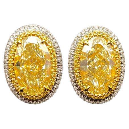 GIA Certified 6.06ct Oval Y-X 'Yellow' Diamond Earrings For Sale