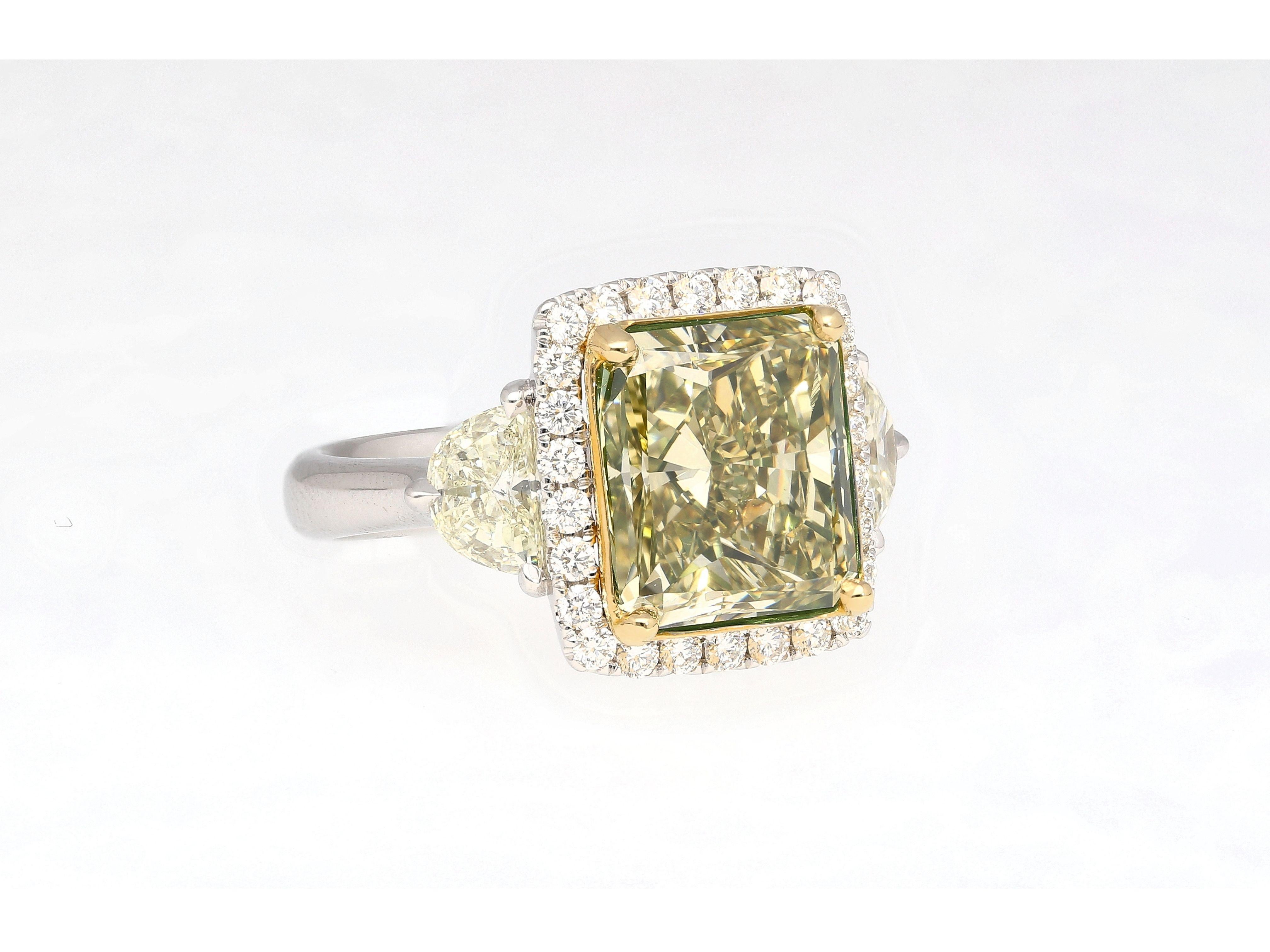 GIA certified 6.07 carat fancy brownish greenish yellow radiant cut diamond engagement ring. Set in 18k white and yellow gold. The ring features a round brilliant cut white diamond halo and pave set ring shank, yellow gold prongs, and an open back