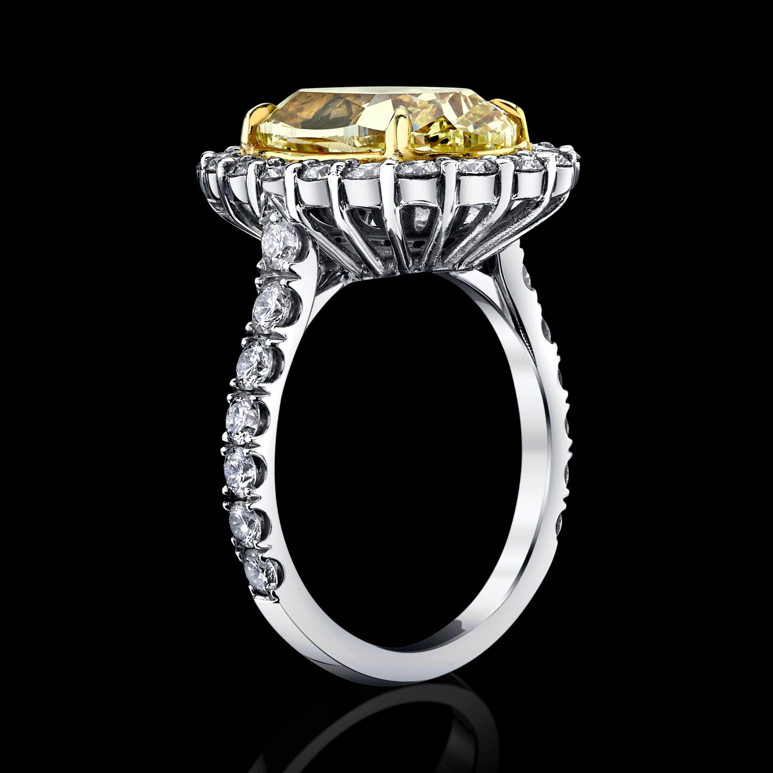 6.08ct Oval Fancy Intense Yellow diamond is set in 18K white Gold, + 34 Round colorless diamonds F color, VS1 clarity =1.58cttw
This large diamond ring shows so beautifully and romantic. The center diamond is large with an intense yellow color that