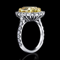 GIA Certified 6.08 Carat, Oval Cut, Fancy Intense Yellow Diamond Ring