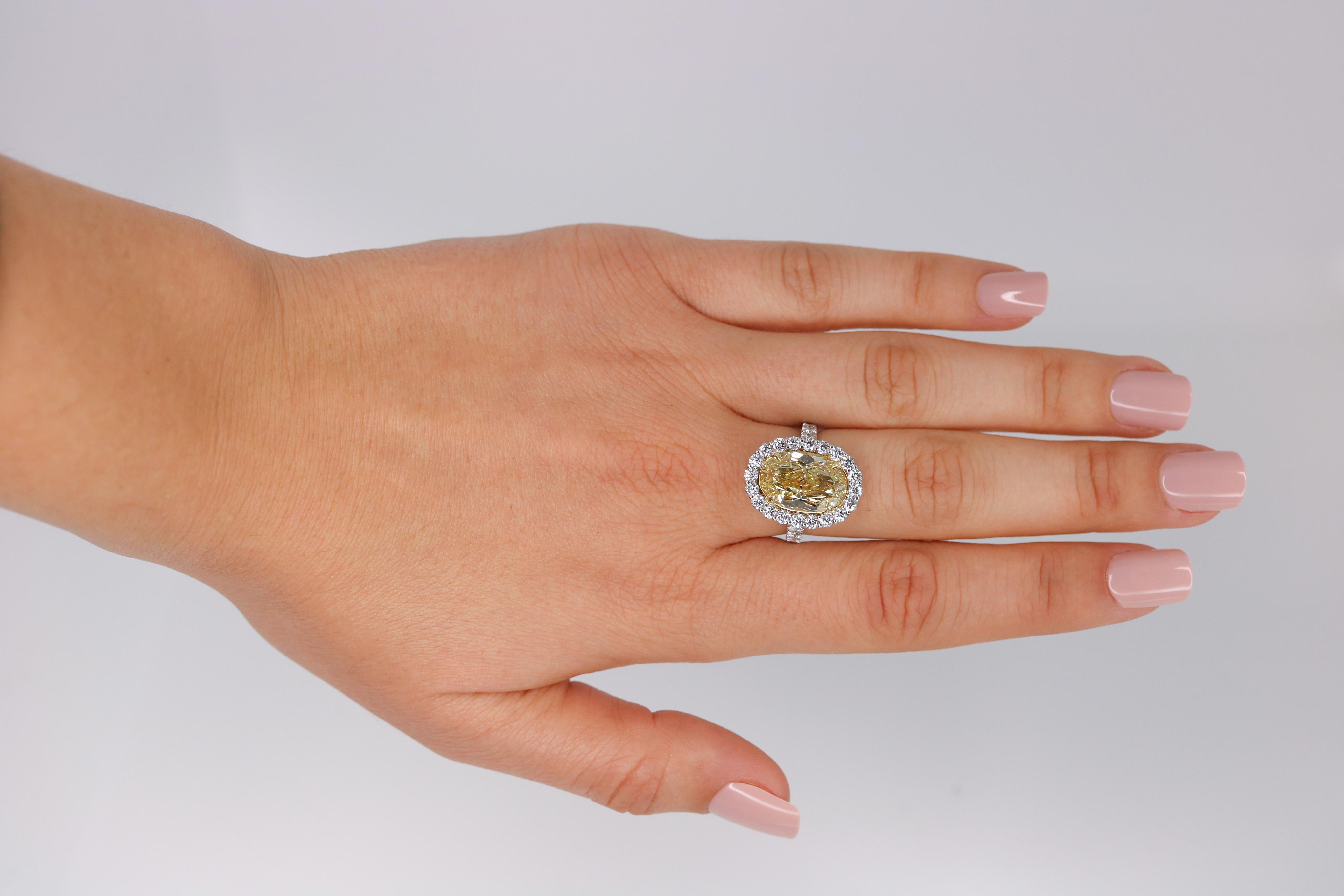 Women's GIA Certified 6.08 Carat, Oval Cut, Fancy Intense Yellow Diamond Ring For Sale