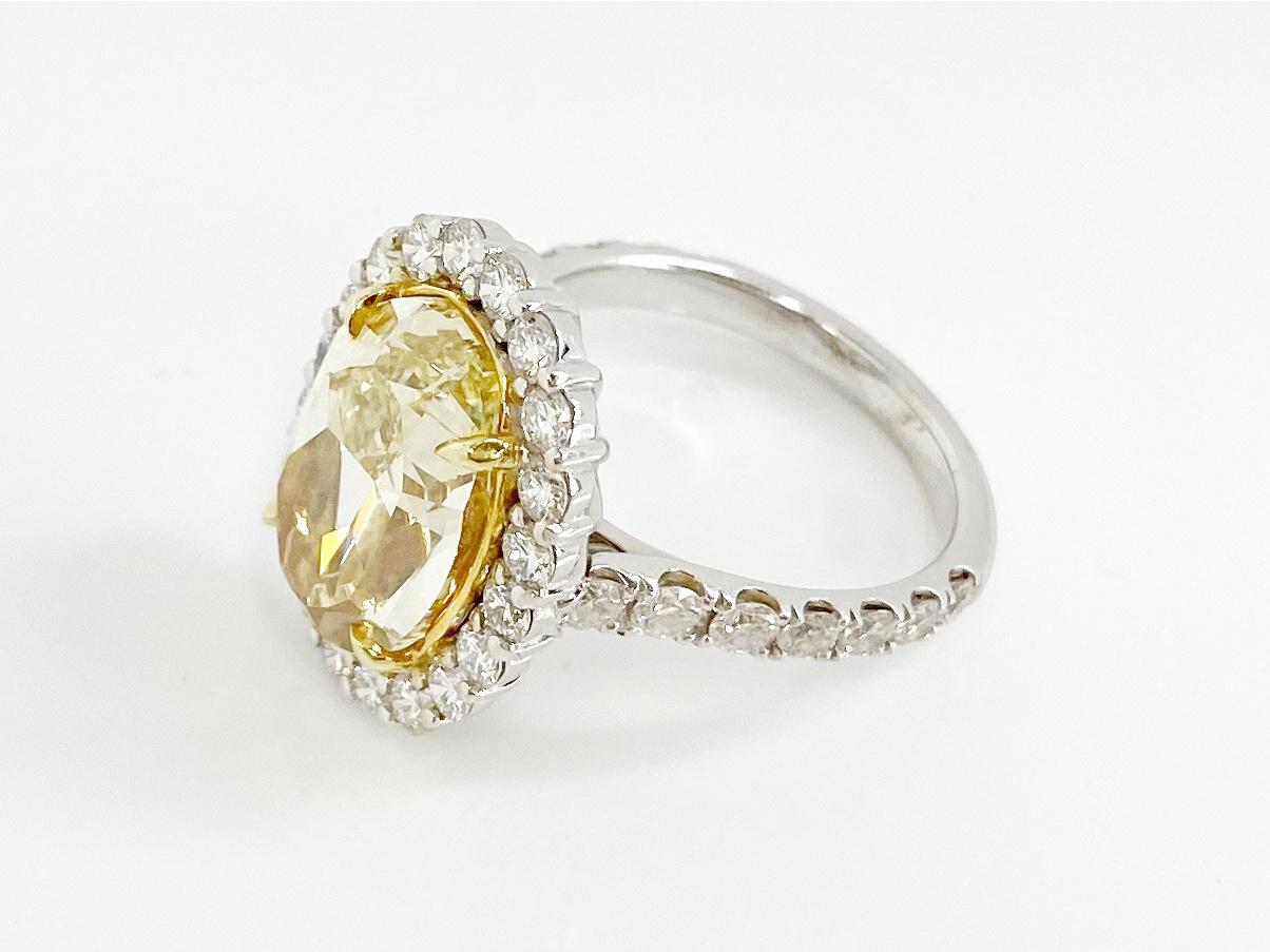 GIA Certified 6.08 Carat, Oval Cut, Fancy Intense Yellow Diamond Ring For Sale 1
