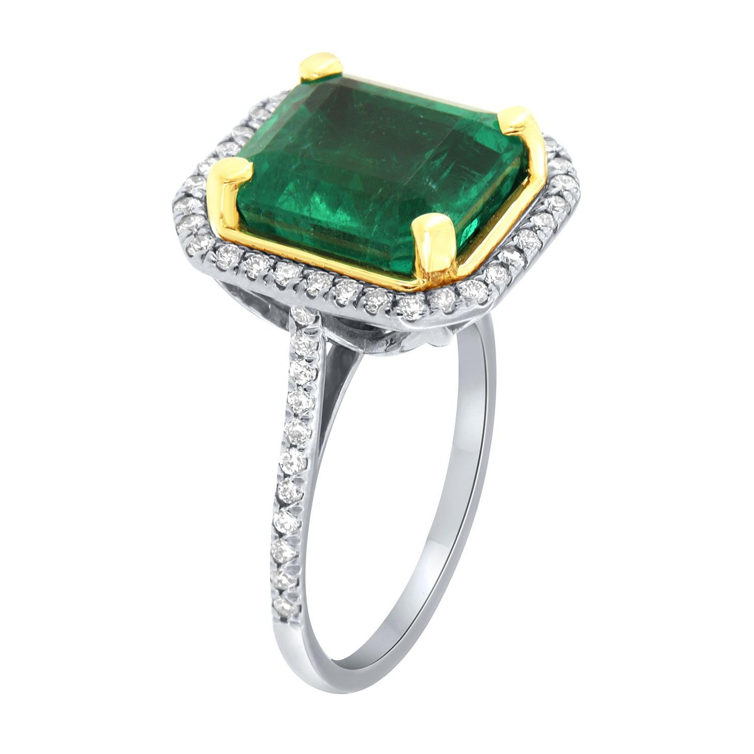 This 18K White and Yellow gold ring features a 6.09 - Carat Ascher cut Natural Green emerald from Ethiopia. Excellent bright and vibrant green color. The emerald is encircled by a halo of brilliant round diamonds on a 1.5 mm band. The diamonds are