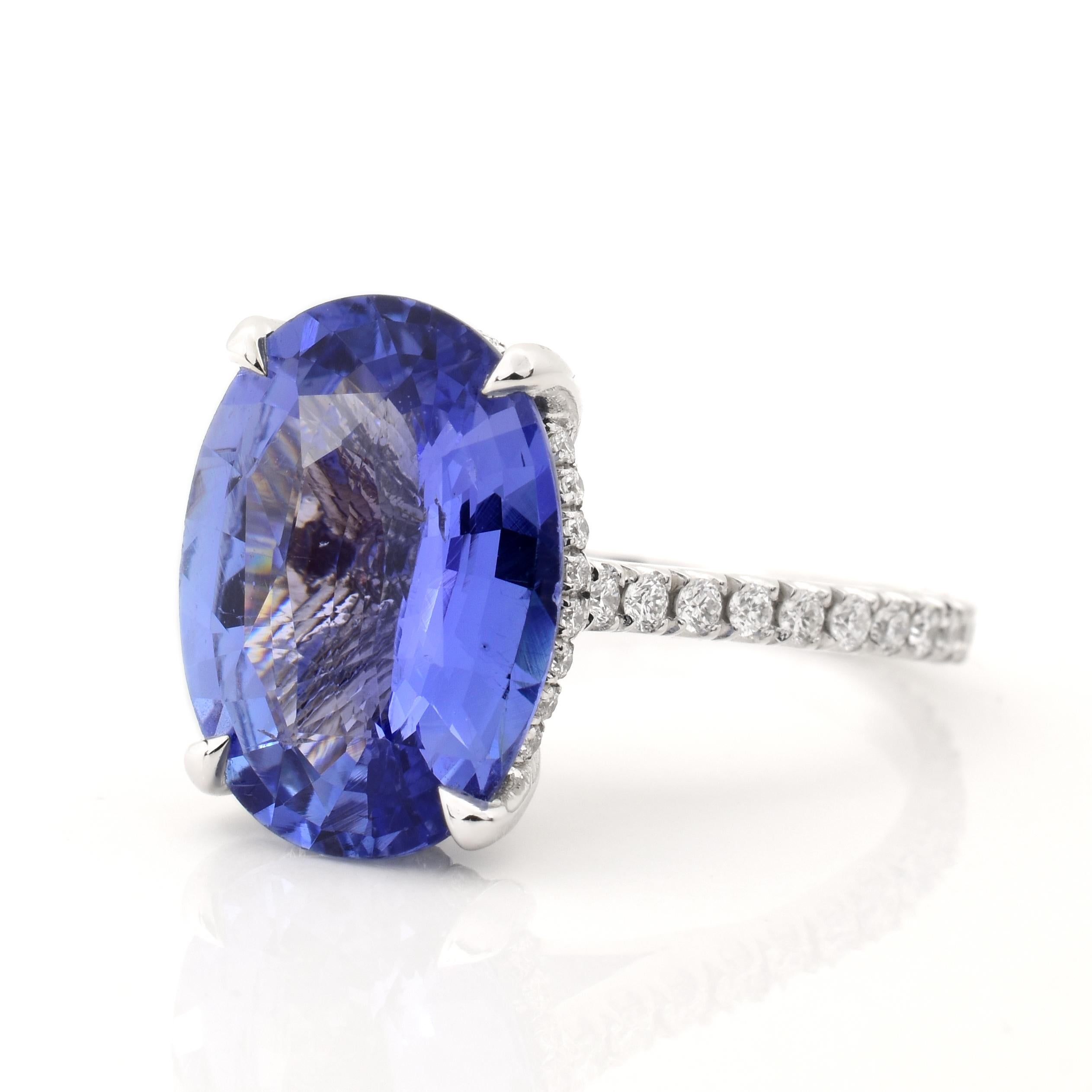 A modern ring in 18k white gold, featuring a 6.11 carat natural light blue sapphire (GIA Report No. 2193418320). There are .50 carats in accent diamonds set around the sides and underside of the basket, down the shank, and directly underneath the
