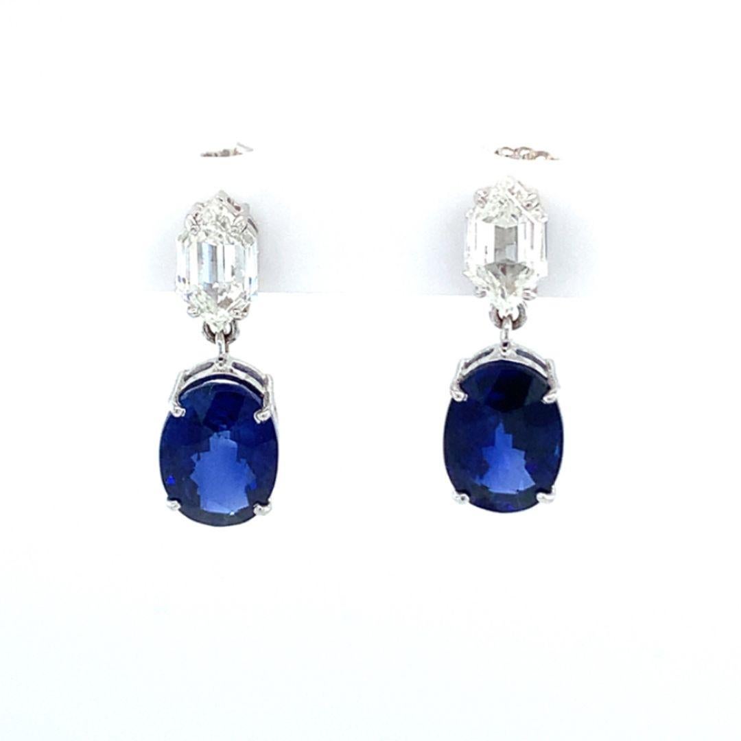 GIA Certified Natural 6.14 Carat oval shape blue sapphire and 1.63 Carat Diamond Dangle drop earring set in 18 Kt white gold. 

