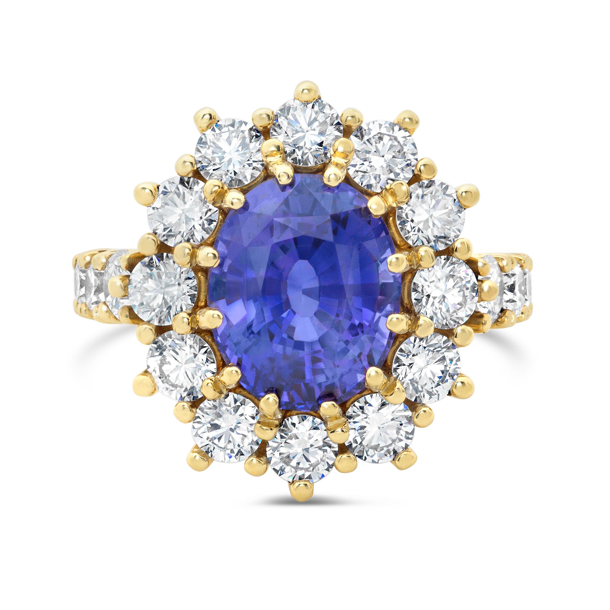 A one-of-a-kind cocktail ring, featuring a 6.17 carats oval brilliant cut sapphire certified by GIA as natural with no indications of heating. Accented by a beautiful halo of round brilliant cut diamonds that continue on to the shank in a