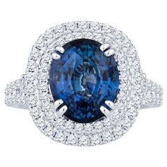 GIA Certified 6.18 Carat Oval Shaped Sri Lankan Sapphire & Diamond Ring