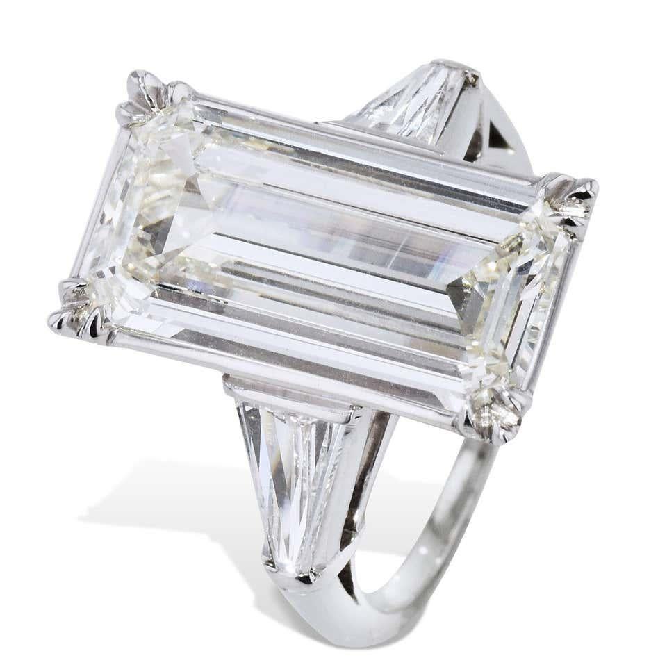 GIA Certified 6.19 Carat Emerald Cut Diamond Platinum Ring 

This emerald cut diamond platinum ring is absolutely stunning! 

This is an amazing GIA certified 6.19 carat emerald cut diamond that appears as large as a 10 carat, due to its unique cut.