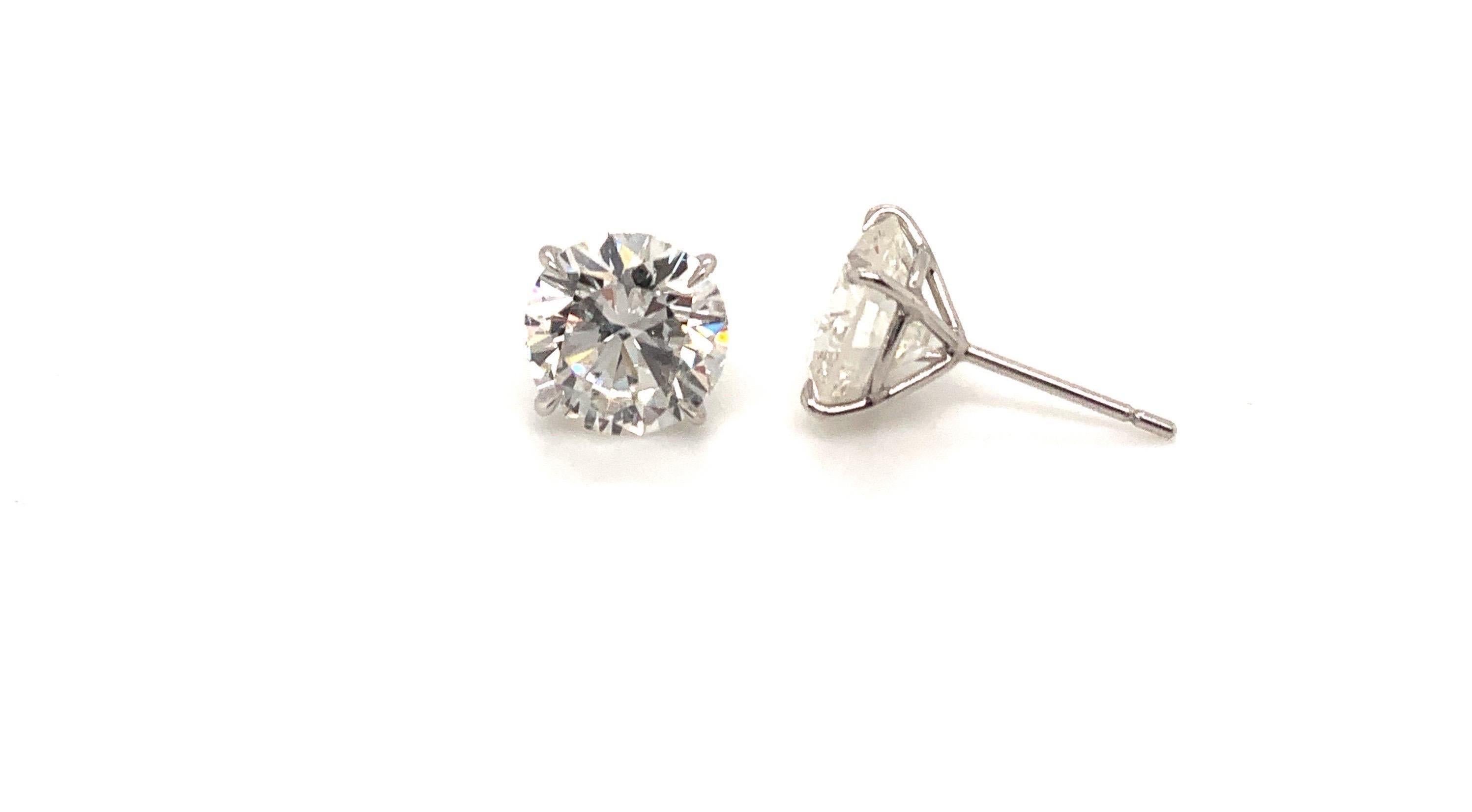 Stunning pair of GIA Certified Round brilliant cut Diamond Stud Earrings
Set in hand made platinum on a four prong mounting. The Diamonds in these earrings we’re carefully selected to create the perfect match for these timeless earrings
6.21 total