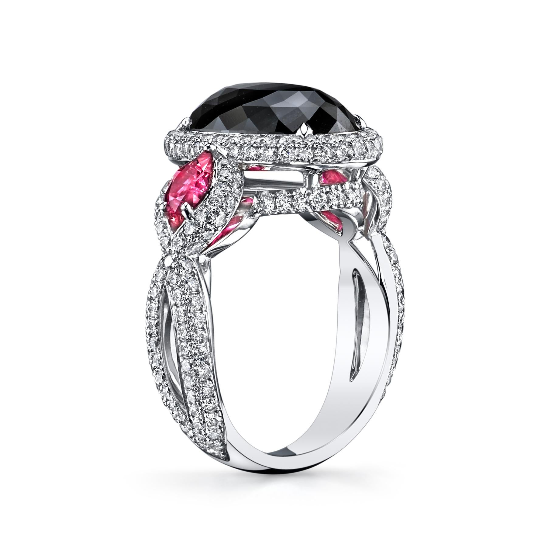 A very unique ring!

6.21ct Oval Fancy Black Natural Diamond with 2 MQ Natural Rubies totaling 1ct, surrounded by stunning natural round colorless diamonds.

This Diamond is GIA certified. 