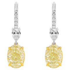 Diana M. GIA Certified 6.22 Carat Oval Shaped Yellow Diamond Earrings