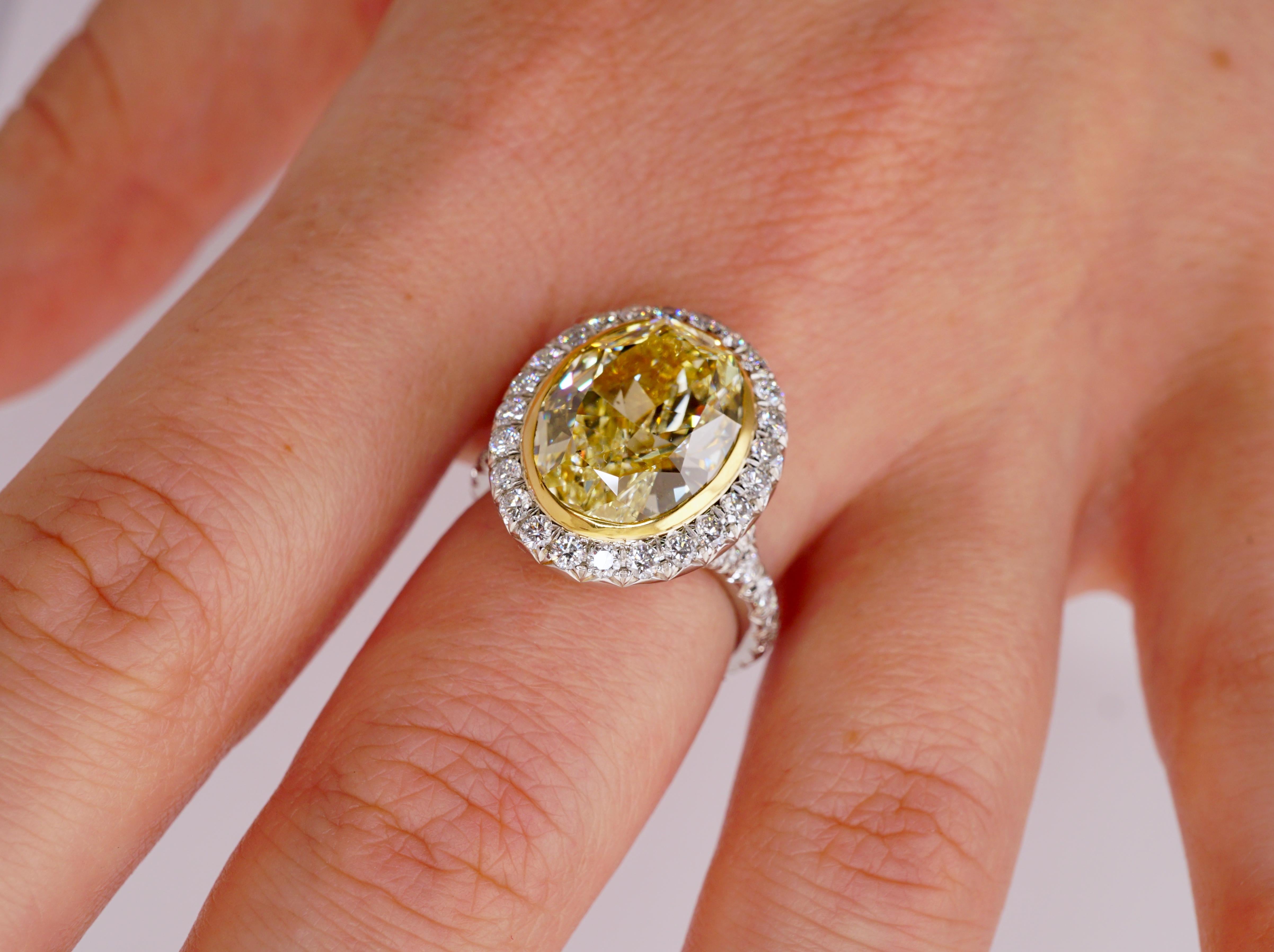 Modern GIA Certified 5.12 Ct Fancy Yellow Oval Diamond Engagement Ring in Platinum