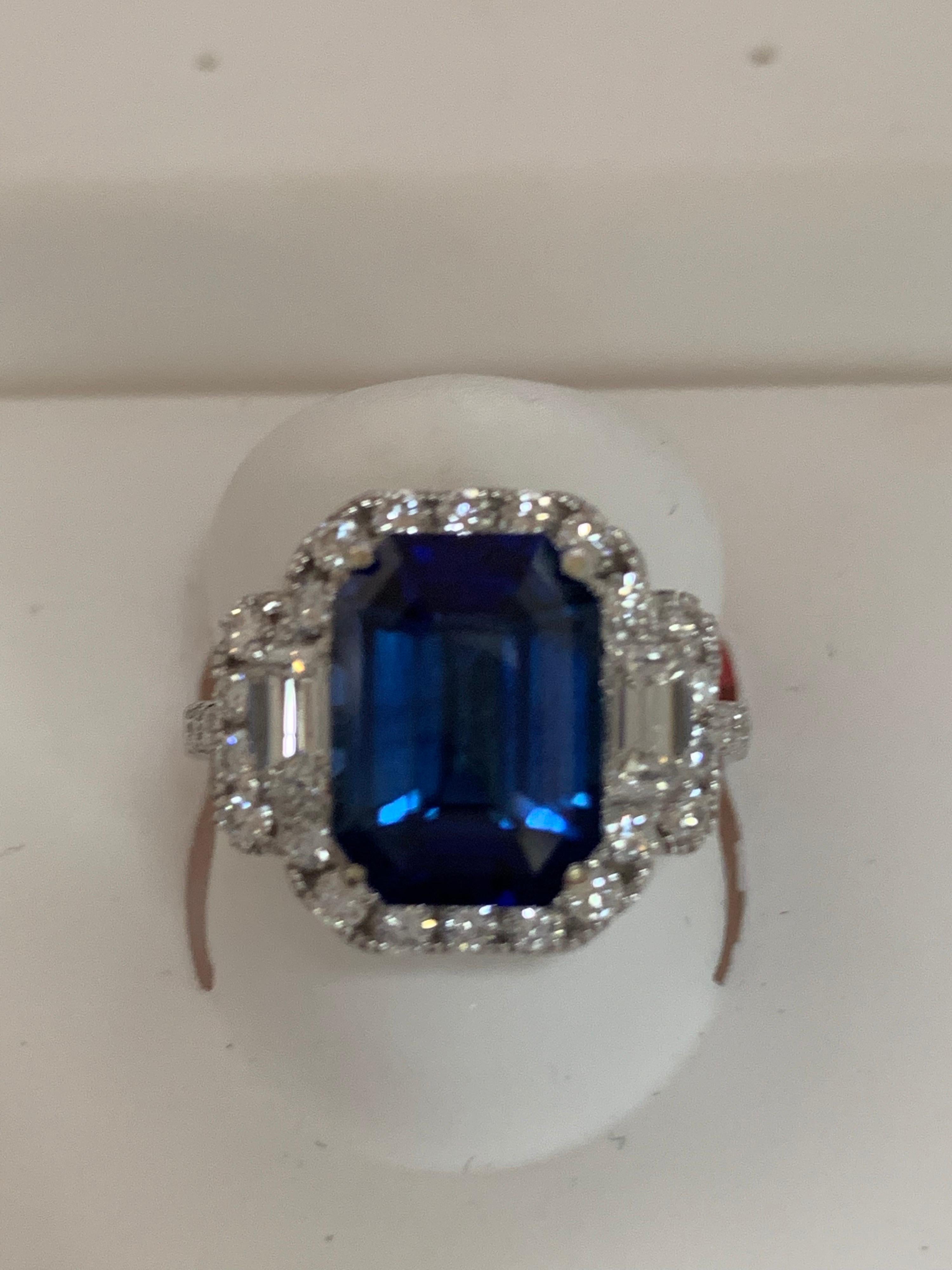 Natural GIA Certified 6.26 Carat Blue sapphire and total 1. 15 carat white diamonds set in 14 Karat white gold is one of a kind handcrafted ring, The ring is size 7 but can be resized if needed.