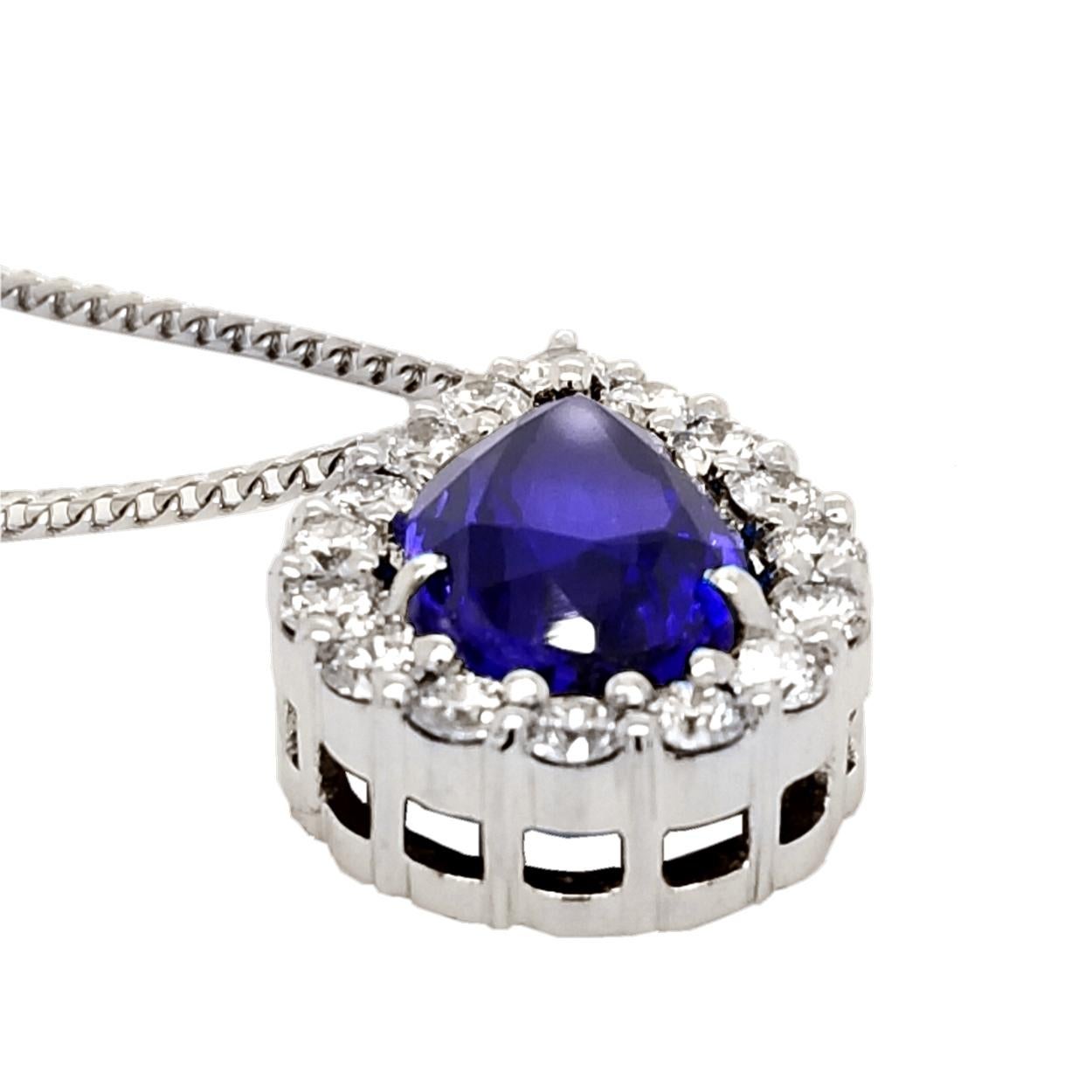 This Beautiful 18K Tear Drop Necklace with 16 2.6 mm Natural Round Diamonds total weight of 1.20 Ct (Shared Prong Set) hosts a magnificent color Tanzanite weighing 6.26 Ct.
Center Stone: 
GIA Certified 6.26 Ct Tanzanite
Dimension: 12.69x8.66x7.55