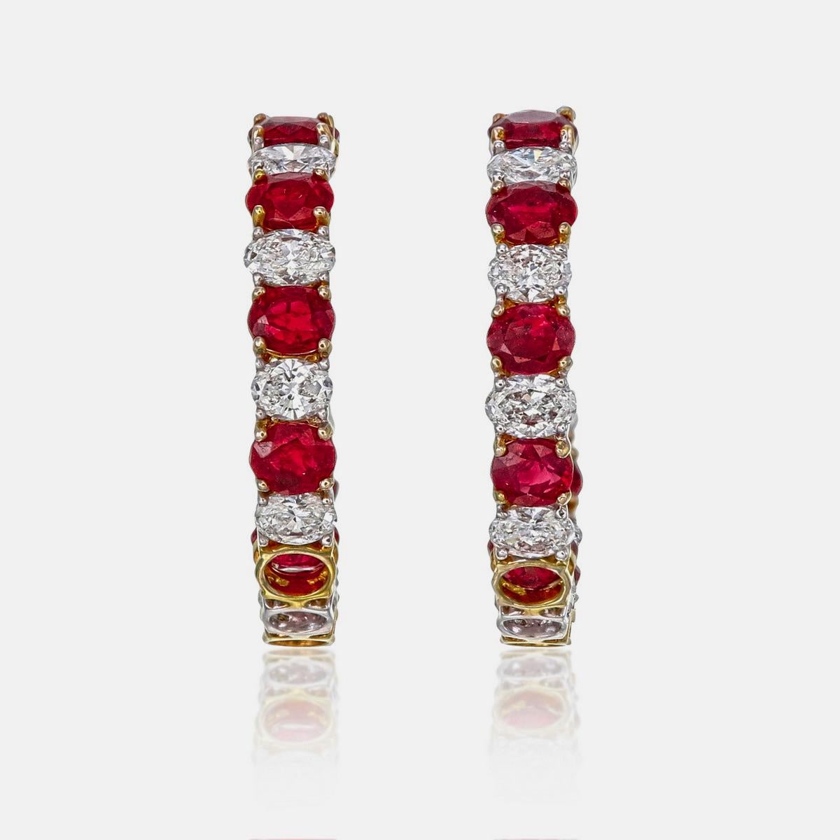 A brand new pair of ruby and diamond earrings by REWA jewelry. 

Inspired by the timeless hoop design, this pair showcases natural Burmese rubies, all untreated for purity and authenticity. Six rubies were randomly selected and certified by the