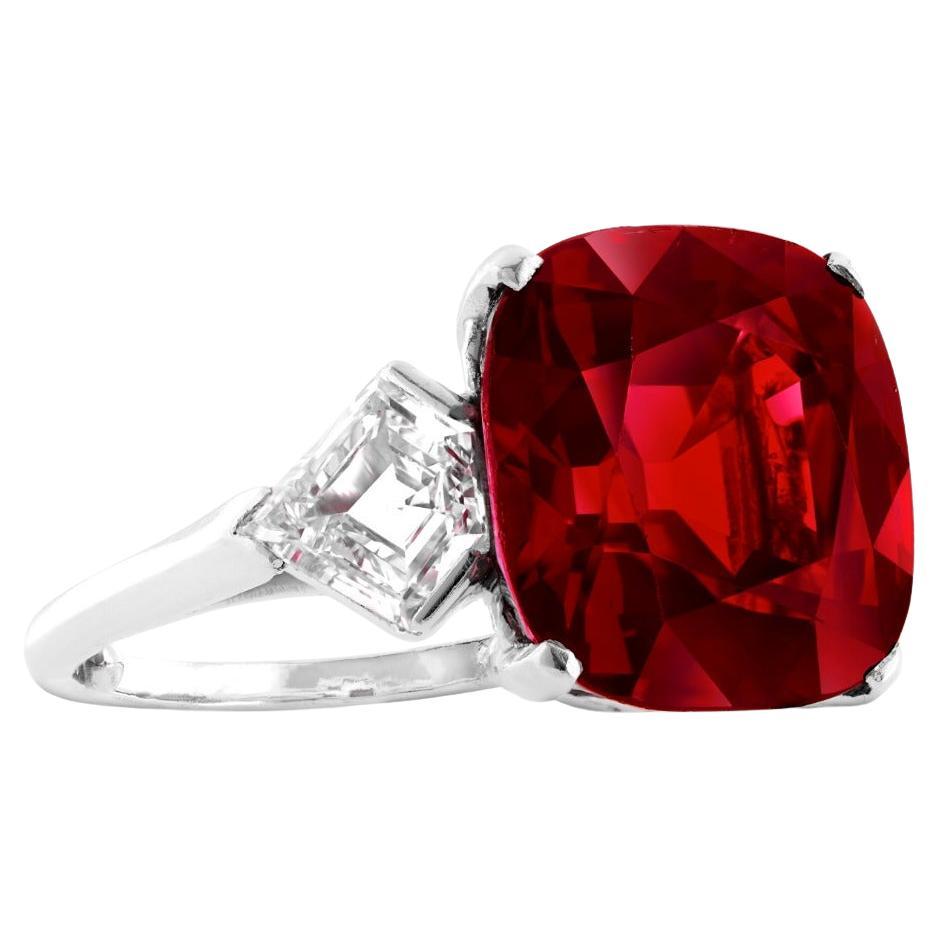 GIA Certified 6.28 Carat Ruby and Diamond Three-Stone Ring

A magnificent ruby graces the center of this elegant three-stone ring, weighing 6.28 carats and certified by GIA. The ruby displays a vivid red hue with a beautiful crystal quality, and