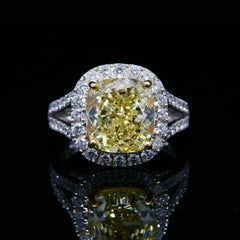 GIA certified 6.29ct Fancy Yellow Cushion Cut Diamonds Ring