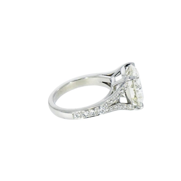This stunning Diamond engagement ring features a Round brilliant cut Diamond set in a Platinum split shank mounting and is accented with 32 round brilliant pave diamonds down the sides, totaling 0.48 carat.
The Center Round Diamond is Certified by