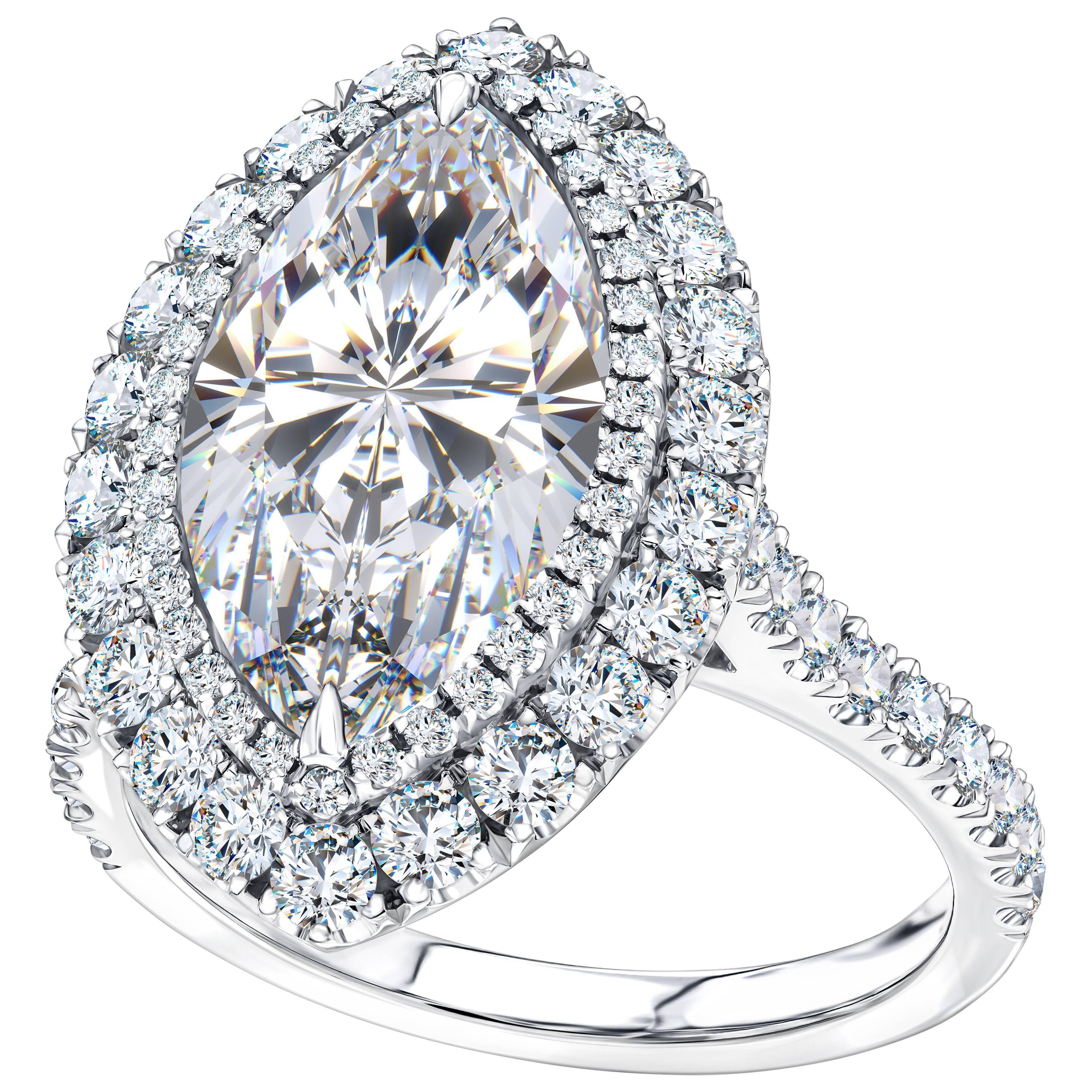 This Spectacular GIA Certified 5.01 Carat Marquise Diamond Engagement Ring Color F Clarity SI2 features a double halo of 1.31 Carat of White Round Brilliant Diamonds Color H Clarity SI1 set in Platinum this stunning ring sparkles like none other. UK