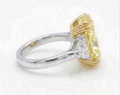 GIA Certified 6.34 Carat Oval Cut Fancy Yellow Diamond with Trillion Ring