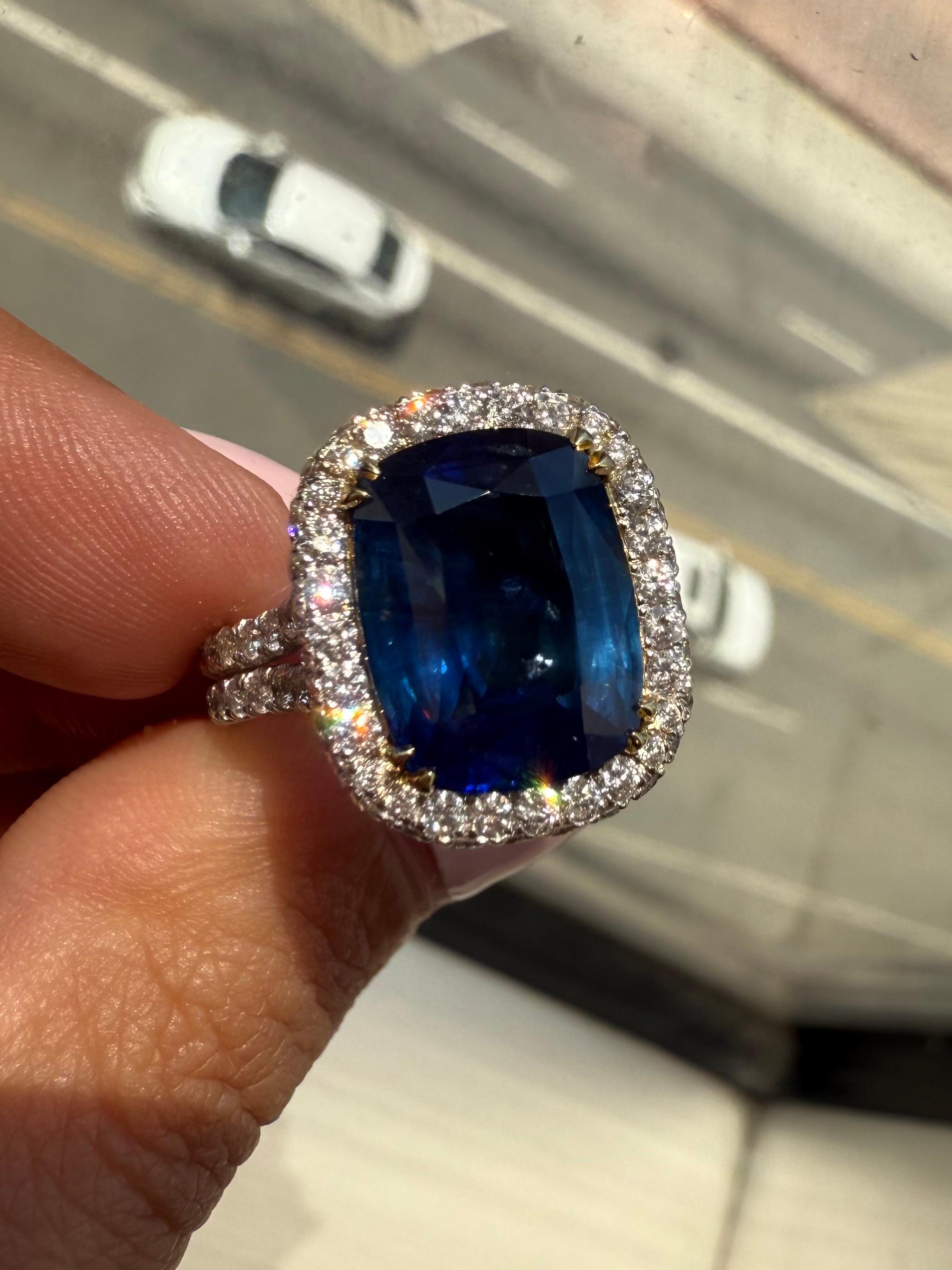 Elegant and timeless, this showstopping ring features a 6.35-carat Elongated cushion cut sapphire, certified by GIA. The sapphire displays a rich, velvety blue color and is transparent with excellent brilliance, enhanced by precision faceting and a