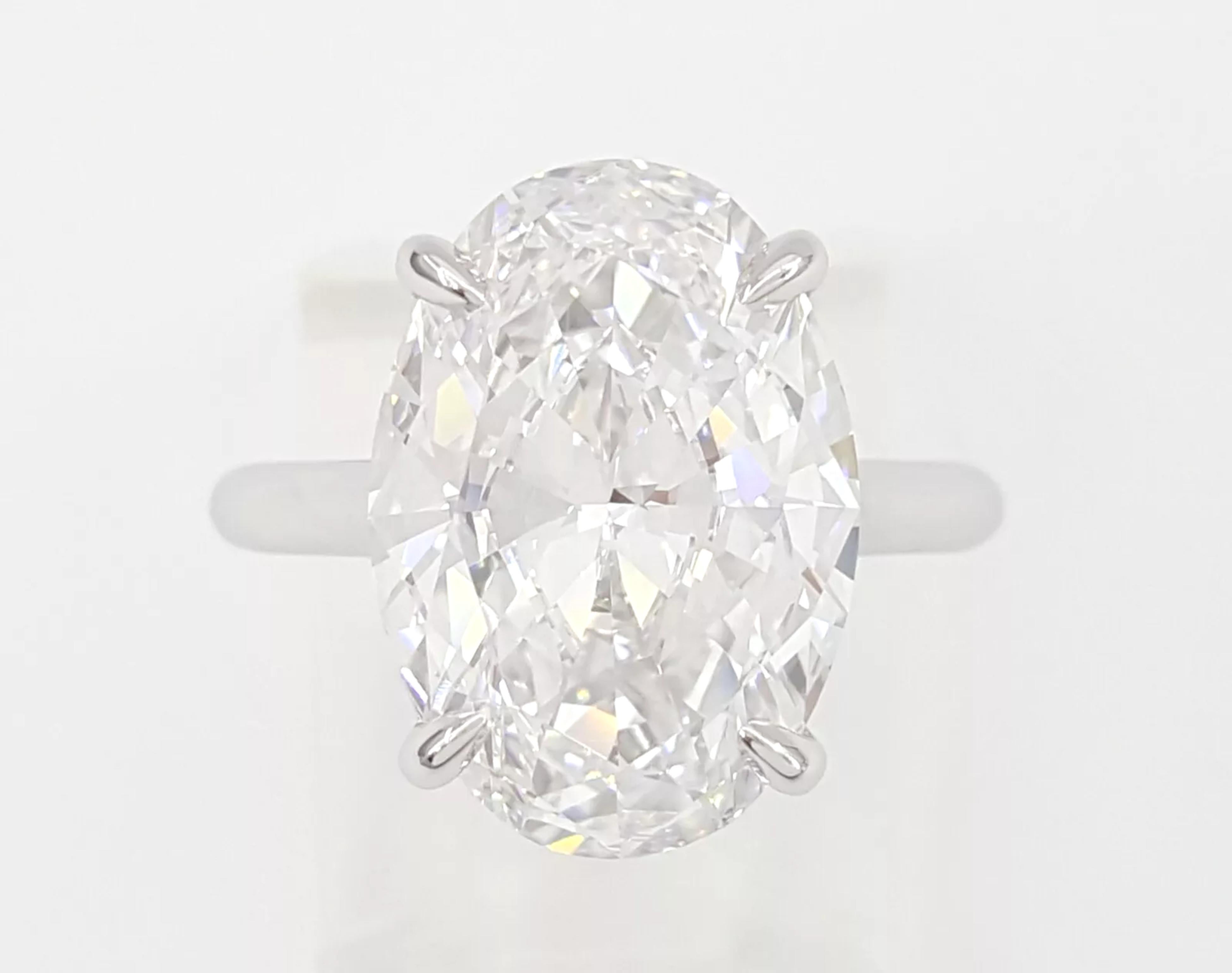 GIA Certified 6.40 Carat  Oval Platinum Ring In Excellent Condition For Sale In Chicago, IL