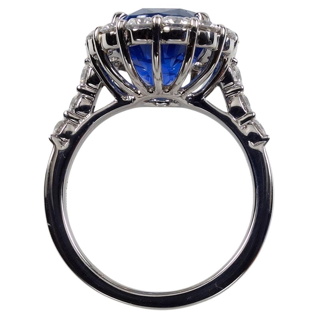  timeless elegance of our Platinum Ring featuring a centerpiece of a breathtaking unheated 6.40ct Oval-shaped Fine Natural Sapphire. Certified by G.I.A. with origin from Sri Lanka, this ring captures the essence of unparalleled beauty and