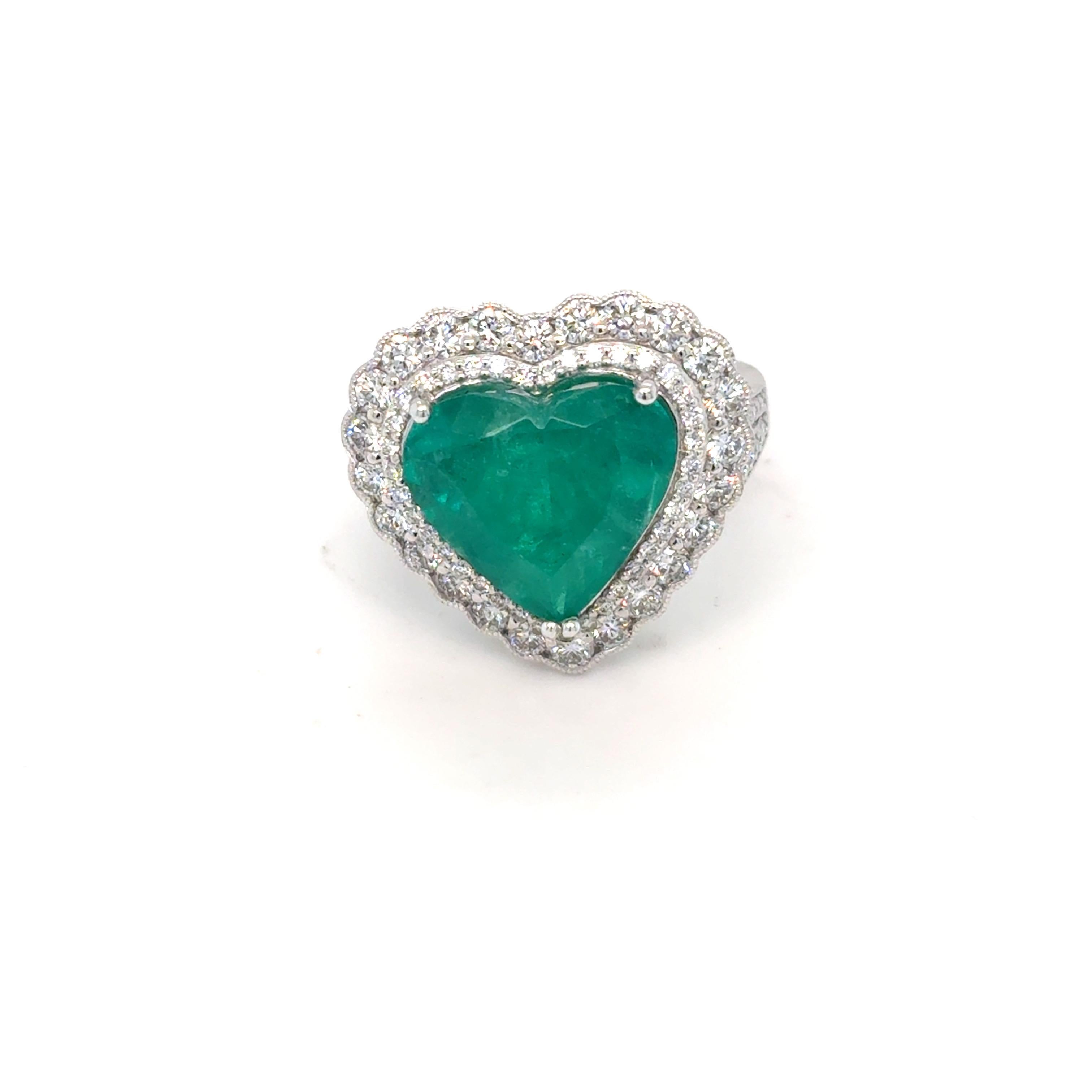 GIA-certified Colombian emerald ring exudes timeless elegance, showcasing a captivating 6.42-carat emerald of exceptional color and clarity. The vivid green center stone is encircled by a luxurious double halo of 1.41 carats of brilliant white