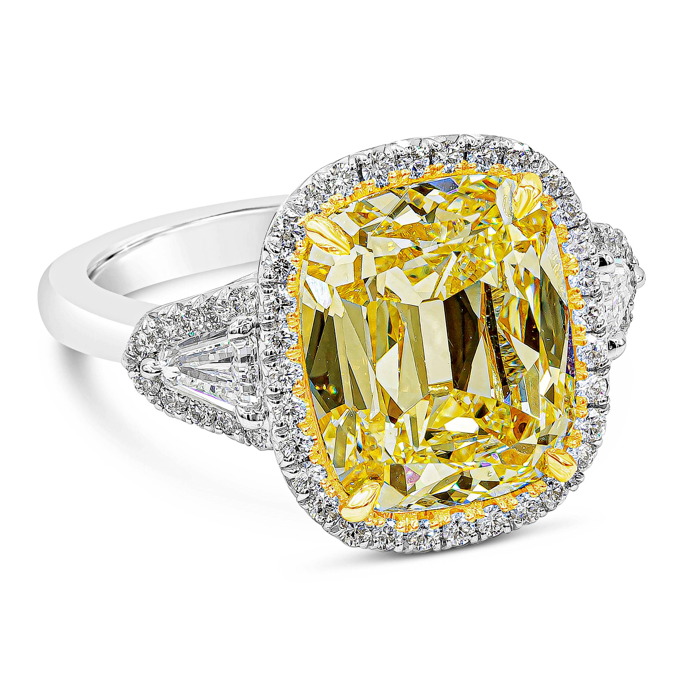A well-crafted engagement ring showcasing a GIA certified 6.47 carat light yellow cushion brilliant cut diamond, U-V color and SI1 in clarity, set in four prong basket made in 18K yellow gold. Surrounded by brilliant diamonds in halo setting,
