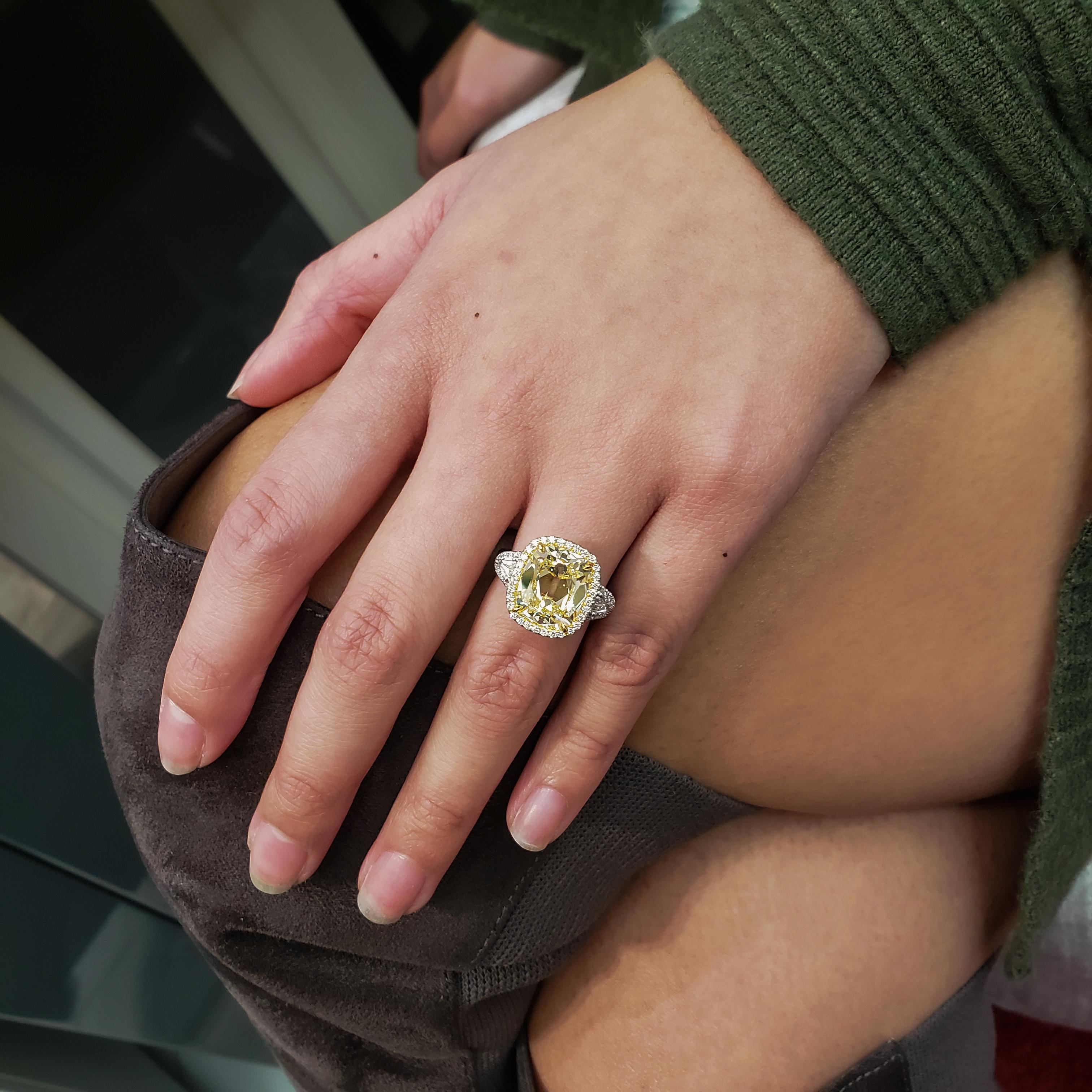 Women's GIA Certified 6.47 Carat Cushion Yellow Diamond Three-Stone Halo Engagement Ring For Sale