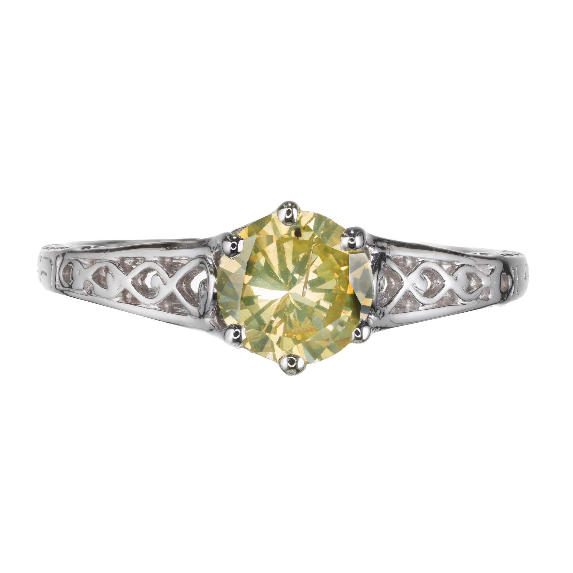 Vintage 1940's yellow and greenish diamond filigree engagement ring. GIA Certified natural diamond center stone in a 14k white gold setting. 

1 round brilliant cut fancy natural grayish greenish yellow diamond I, approx. .65ct GIA Certificate #