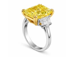 GIA Certified 6.50 Carat Cushion Cut Fancy Yellow Diamond Three Stone Ring