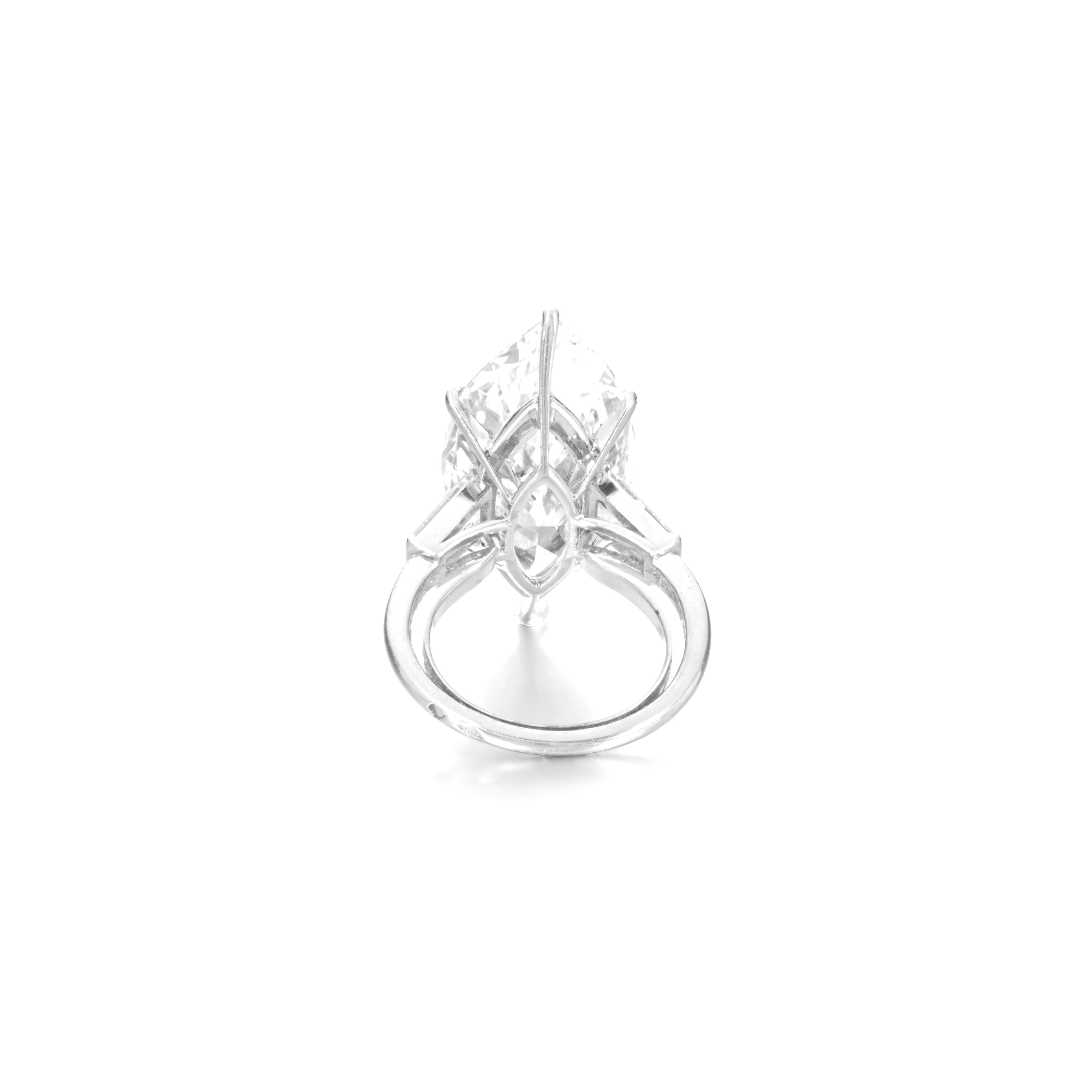 an exquisite 6.53-carat marquise diamond, showcasing a stunning F color with exceptional vs2 clarity. This masterpiece features excellent polish and very good symmetry, ensuring it sparkles brilliantly from every angle. 

Set in a breathtaking