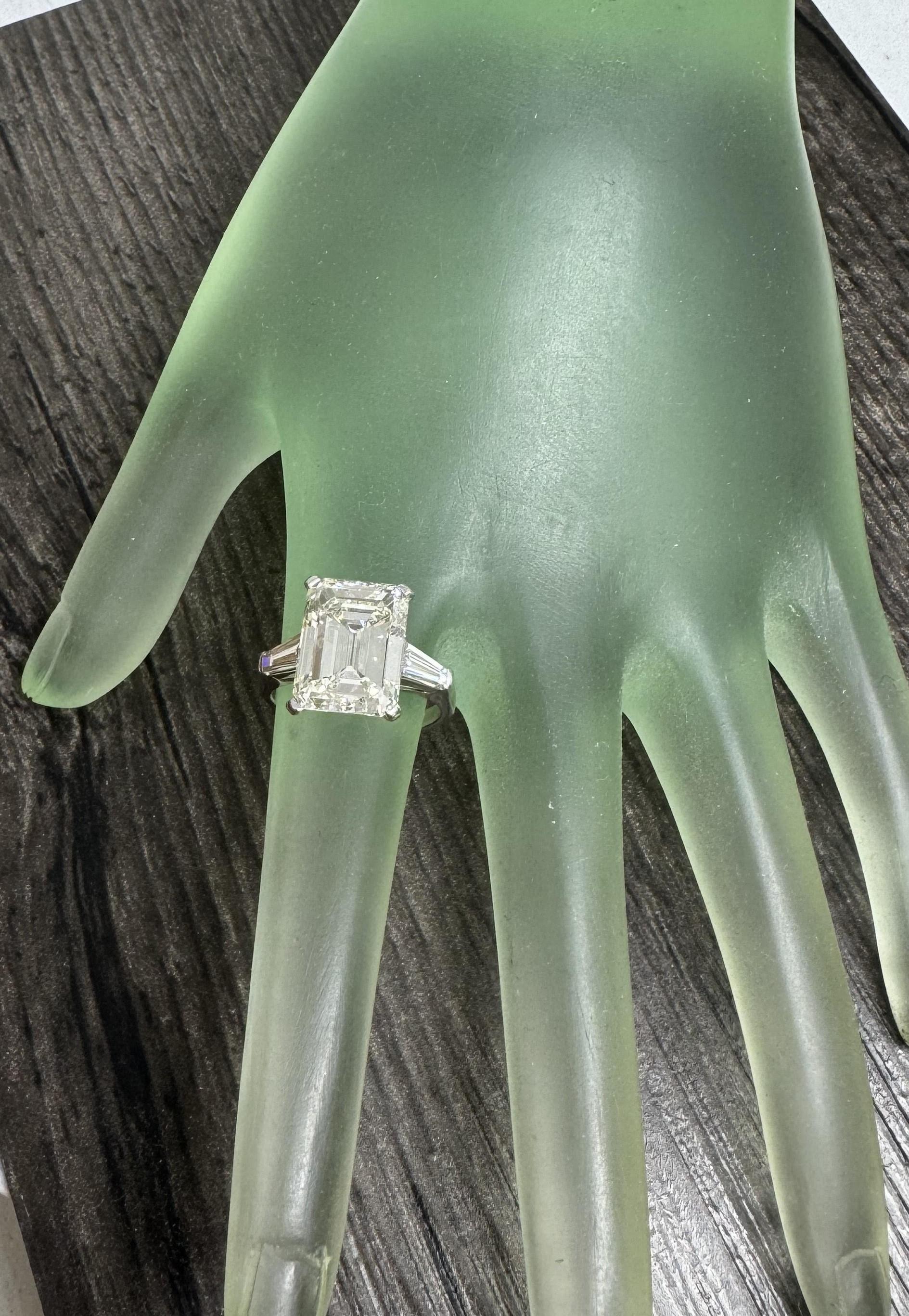 GIA Certified 6.57cts. Emerald Cut Classic Diamond set in Platinum with 2 tapper baguette cut diamonds 
*Motivated to Sell – Please make a Fair Offer*
Specifications:
    main stone: Diamond  6.57cts. Emerald Cut
    certification: GIA Certified
   