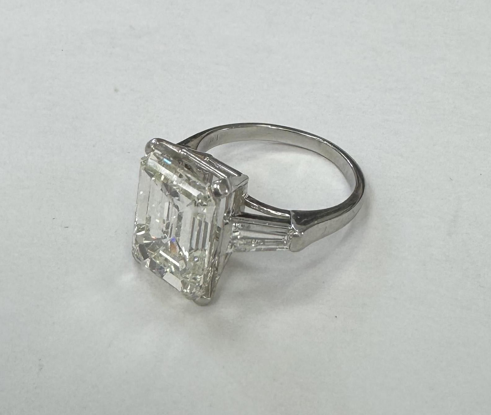 Contemporary GIA Certified 6.57cts. Emerald Cut Diamond Color J Clarity SI1 set in Platinum For Sale