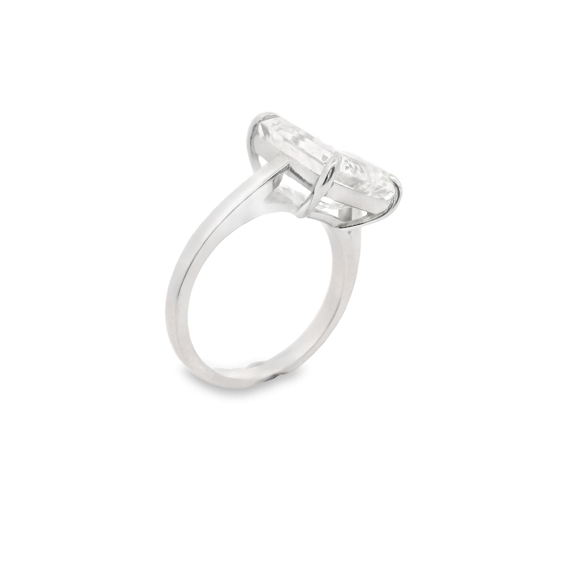 A simple yet striking ring featuring a 6.58 carat emerald cut diamond graded by the GIA as a H color with VS1 clarity, a marvelous stone. The simple four prong platinum setting allows the bright clean diamond to showcase its natural beauty. The