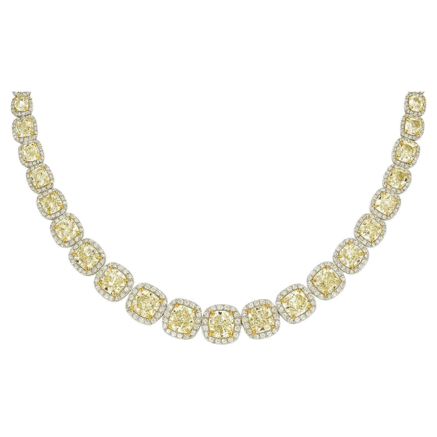GIA Certified 66.60 Carat Fancy Yellow and White Diamond Necklace, Ring and Earrings Suite in 18 Karat White Gold

This extraordinary diamond suite showcases the finest Italian goldsmith artistry, composed of a necklace, a pair of earrings, and a