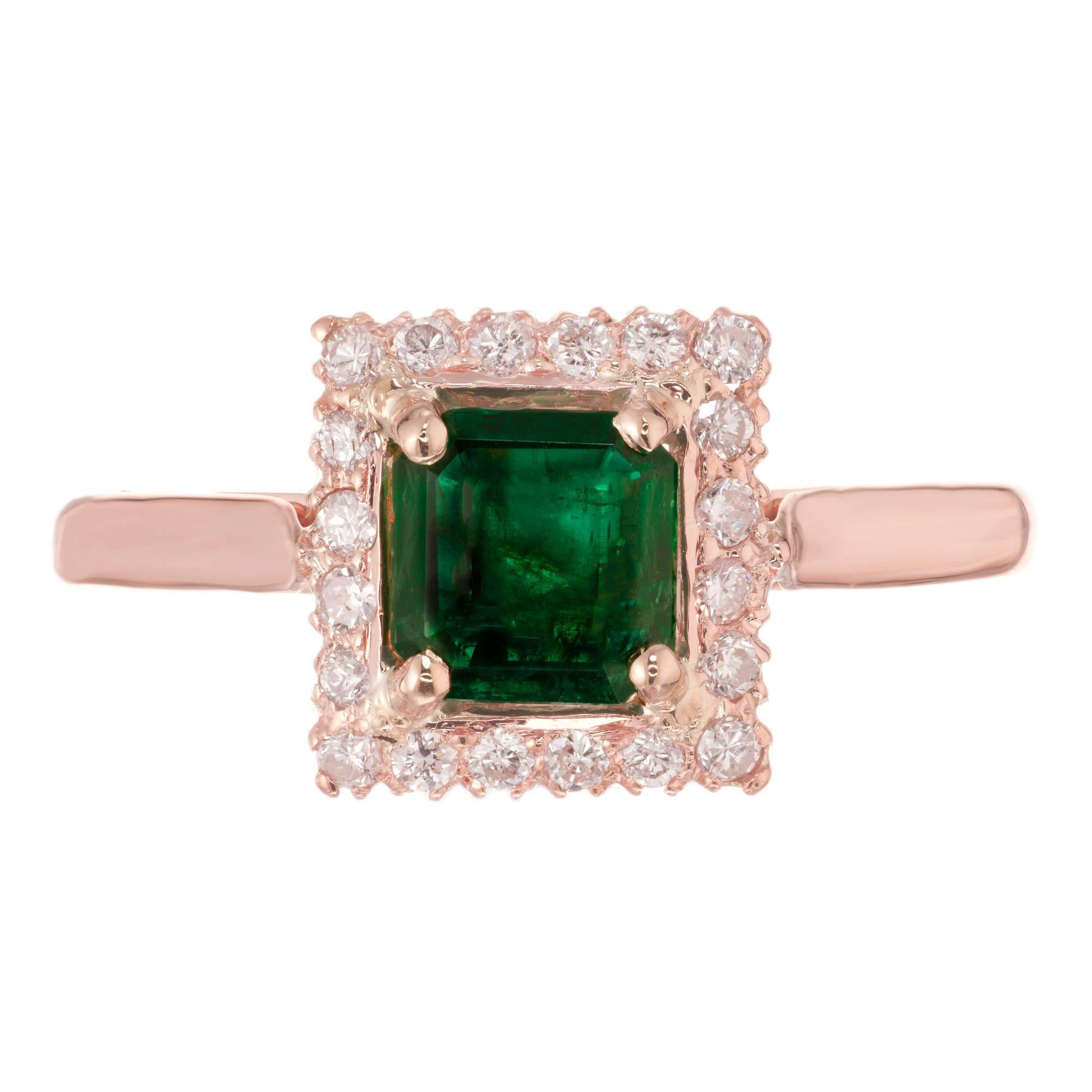 Emerald and diamond engagement ring. GIA certified octagonal emerald center stone set in a 14k rose gold setting with 20 round cut diamond halo. 

1 octagonal .67cts emerald.  GIA certificate 2213095453
20 round cut diamonds, .20cts  G, SI
Size:
