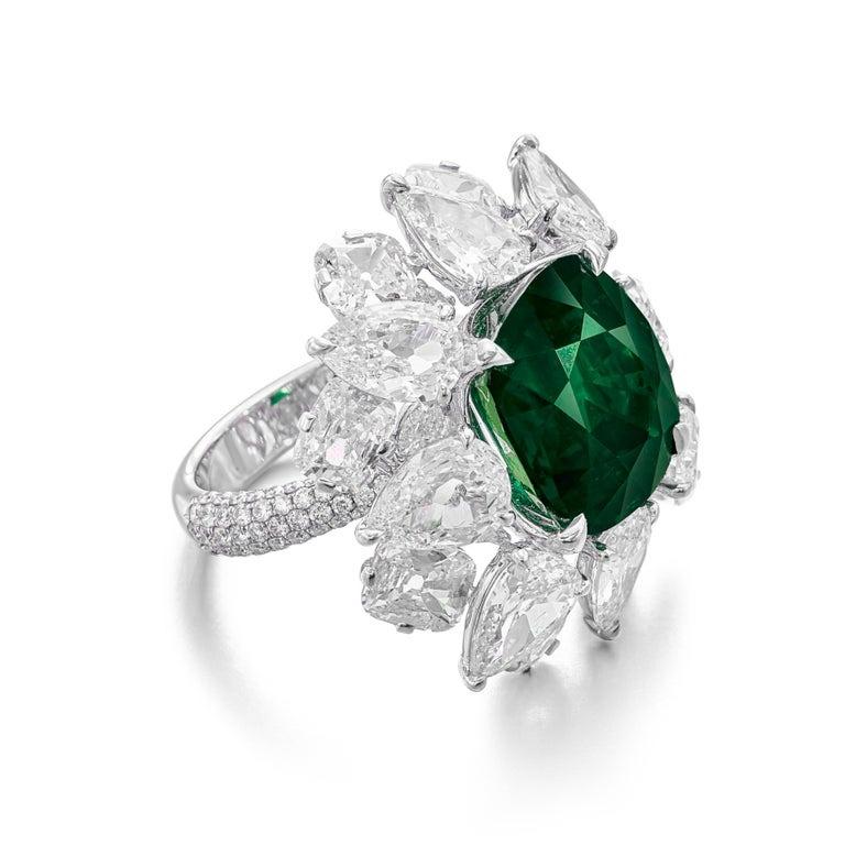 Indulge in timeless elegance with this breathtaking ring, featuring a substantial 6.71 carat cushion cut emerald certified by GIA Sourced from the legendary mines of Muzo—renowned for producing some of the world's finest emeralds—this gem boasts a