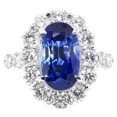 Anello con zaffiro naturale di Ceylon e diamante certificato GIA da 6.75 carati con incastonatura in platino