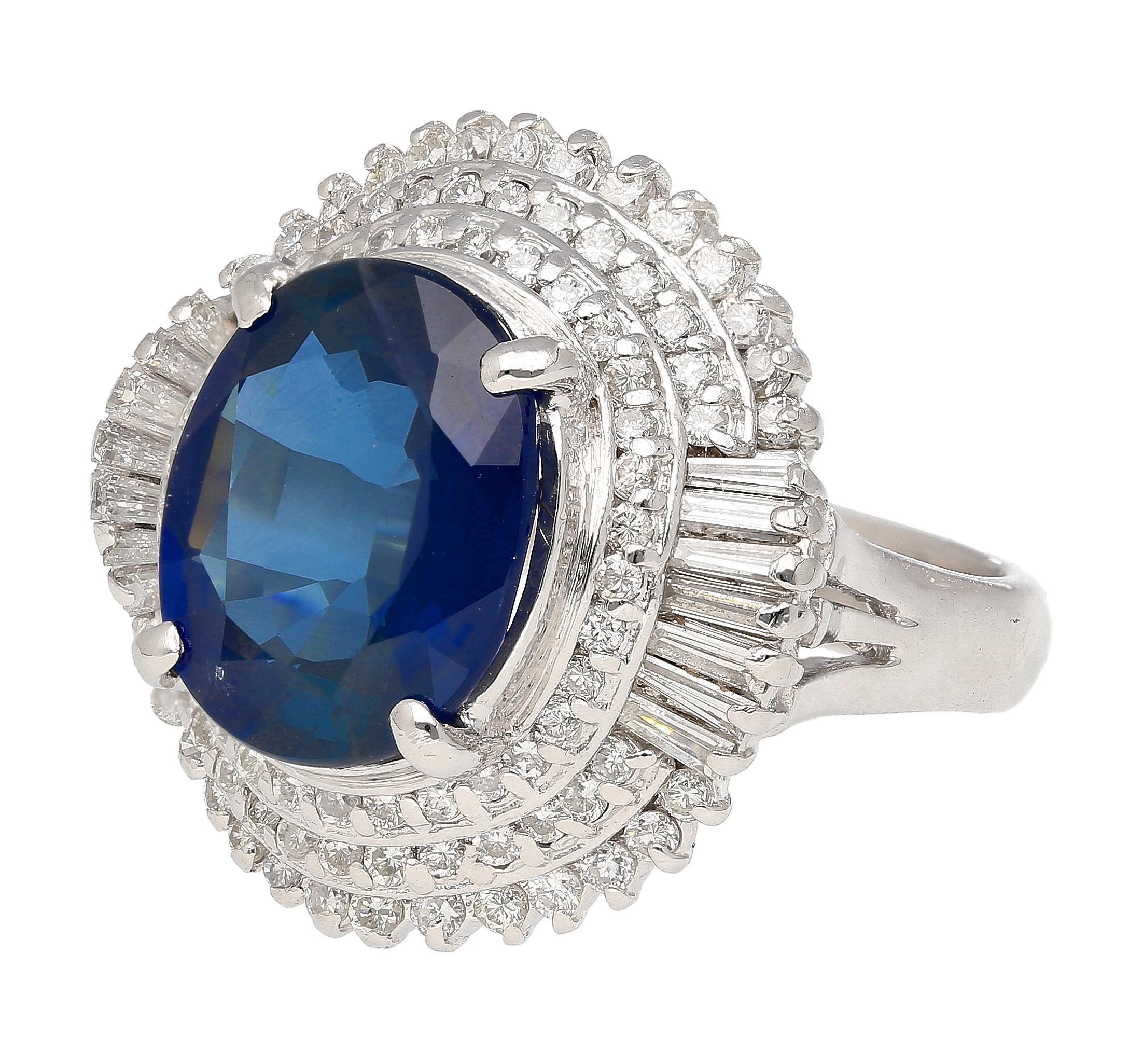 GIA certified 6.75 carat oval cut natural blue sapphire with a a baguette cut diamond halo in a ballerina style platinum 900 ring setting. Ring size 7, adjustable. 

Details: 
Item Type: Cocktail Ring
Metal: Platinum 900
Size: 7
Weight: 14.7