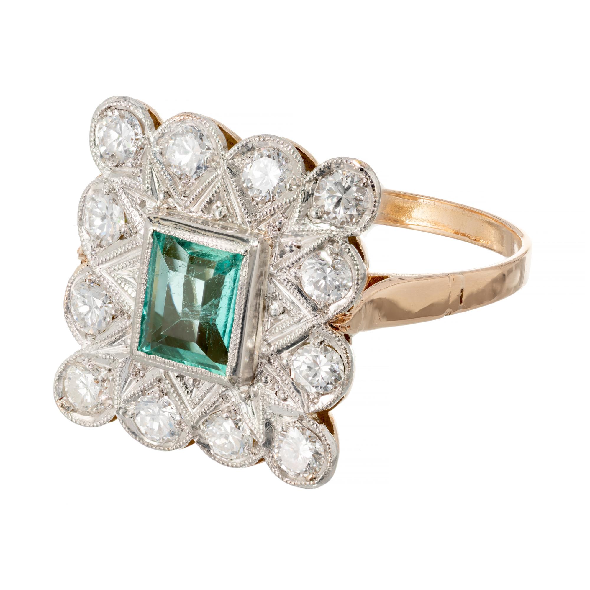 Art Deco Emerald diamond vintage ring. Octagonal center Emerald gemstone set in platinum and 14k rose gold. Handmade ring with a platinum top and a rose gold shank. 

1 octagonal cut green MI Emerald, Approximate .68ct GIA Certificate #