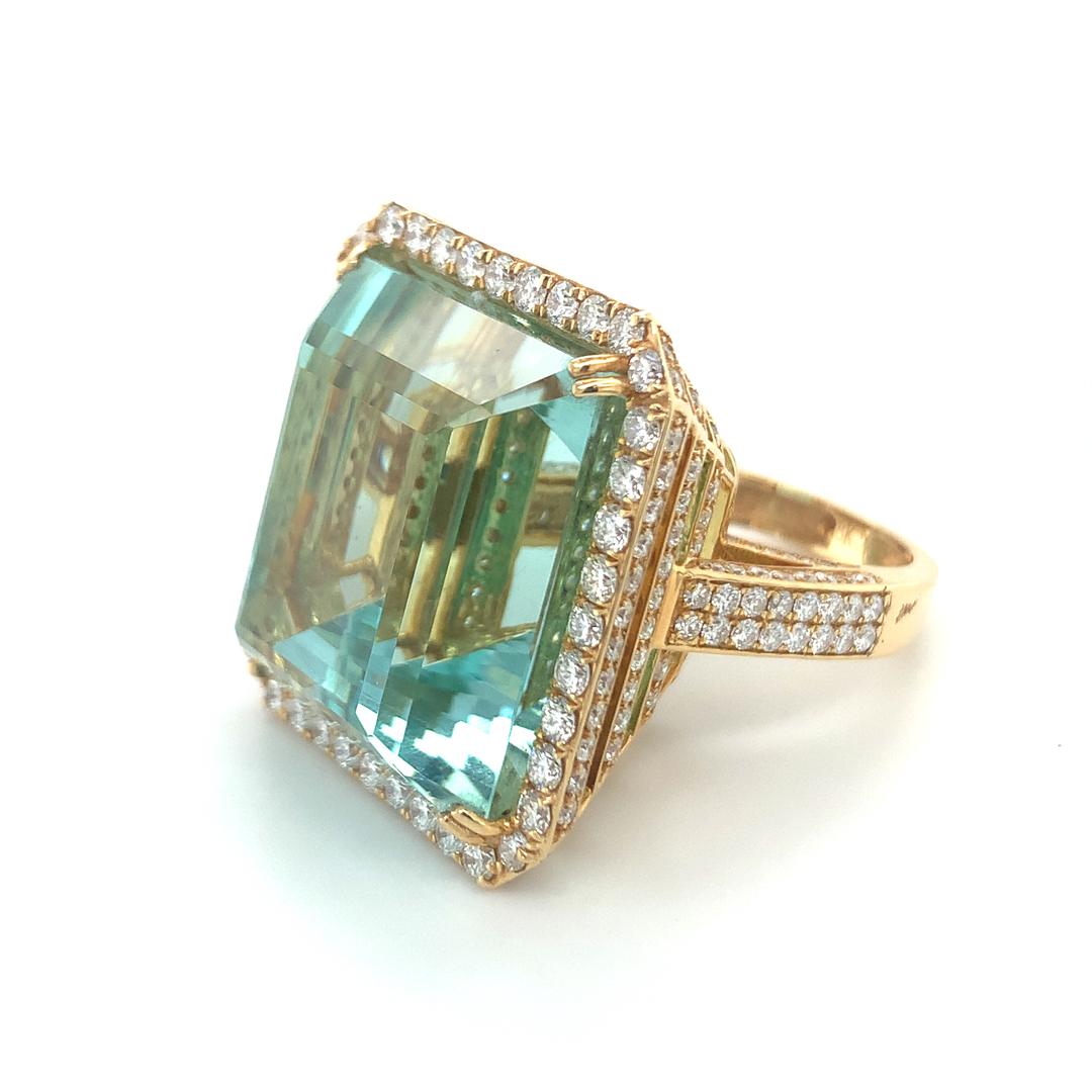 68.06 Carat Natural Brazilian Aquamarine with diamond Halo set in 18 kt yellow gold