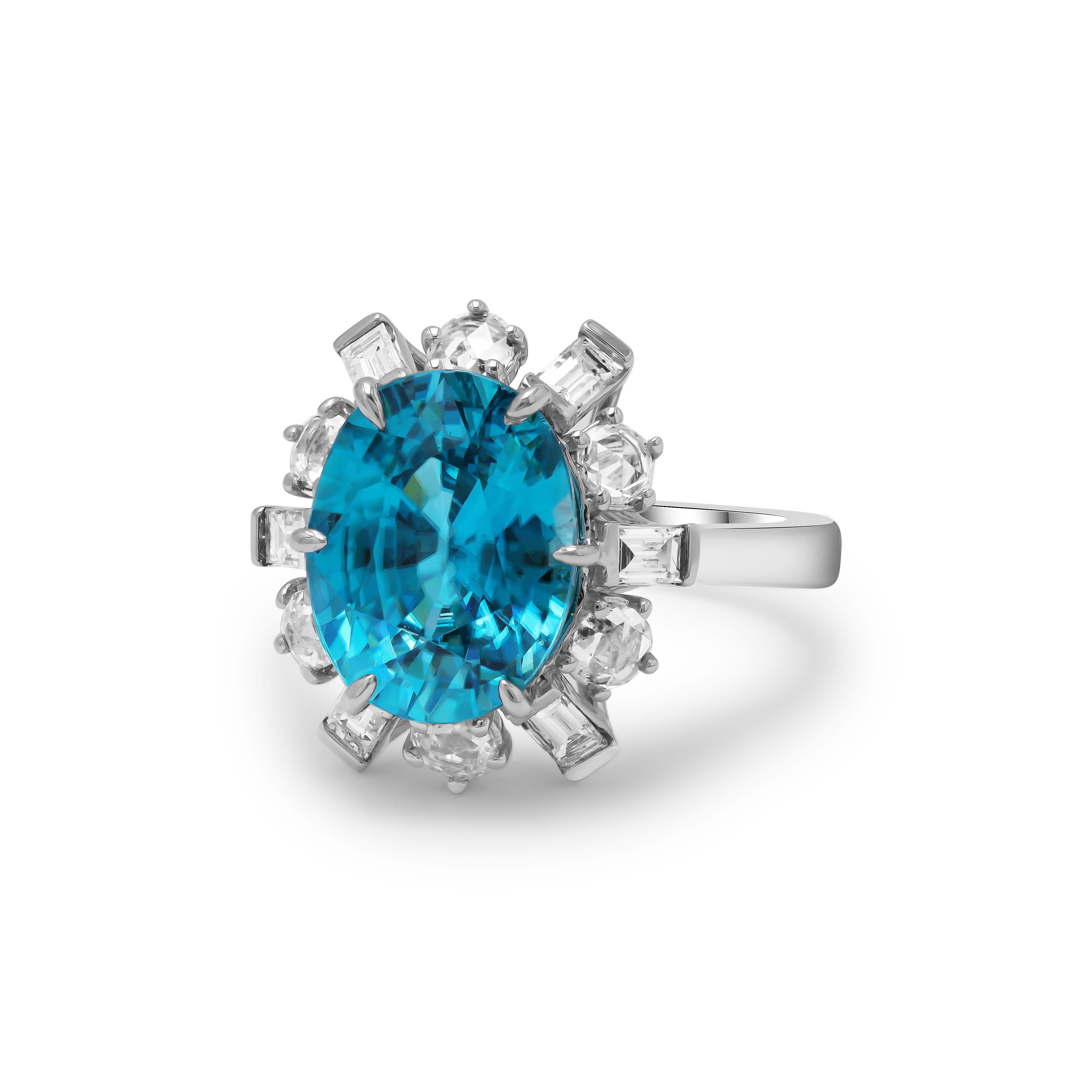 Radiating brilliance from every facet, this ring boasts a GIA Certified 6.85 carat oval-cut blue zircon center, elegantly encircled by 0.83 carats of natural diamonds. The charm of this piece is further enhanced by the intricate hand-engraved