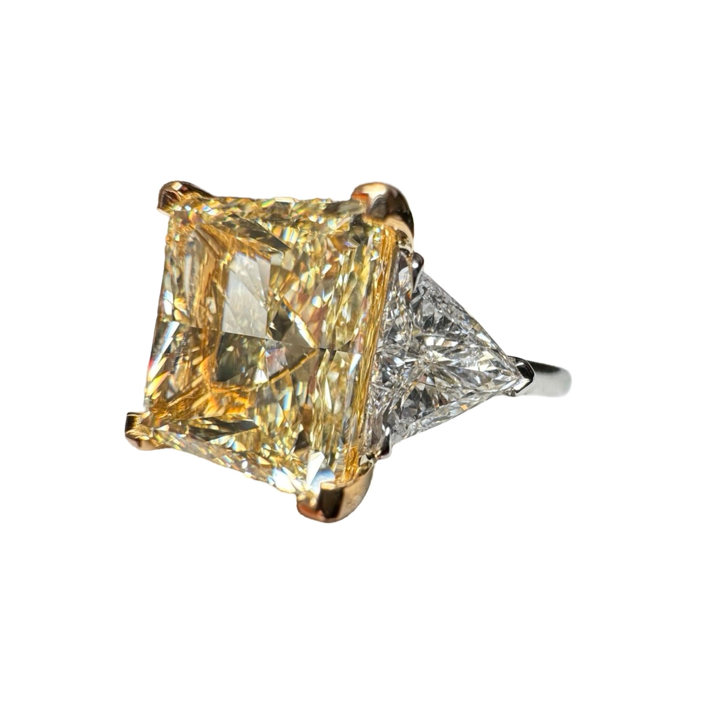 The Rarest Cut to find in a Yellow Diamond: The Princess Cut
A GIA Certified 6.91 Carat Princess Cut Yellow Diamond Three Stone Ring
with exceptional faceting. A very spready 60.5% Depth.
Center Diamond is graded by the GIA as Fancy Light Yellow,