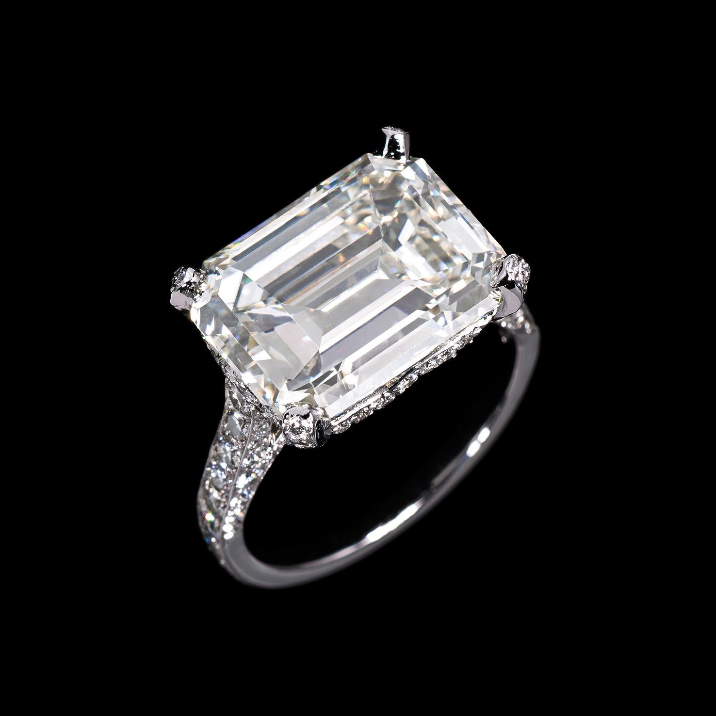 Set with an emerald cut diamond weighing 6.92 carats. Accompanied by a GIA diamond report stating that the diamond is K color, VS1 clarity. Mounted on white gold with pavé diamonds. Made in Switzerland.