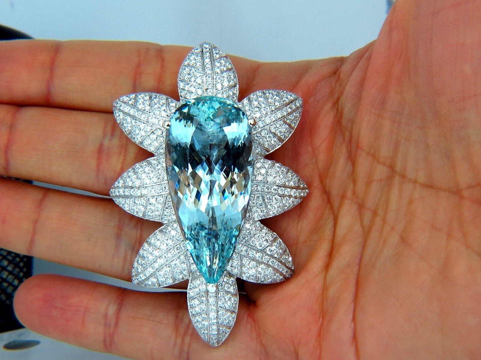 69.37ct. Natural GIA Certified Aquamarine & 8.00ct. diamonds brooch.

3D Still Life Snowflake / Frost Leaf

GIA Report: 5121796919

VS Clean Clarity, Brilliant pear cut.

43.45 X 20.30 X 13.70mm

8.00ct. Natural Diamonds: 

Round Full
